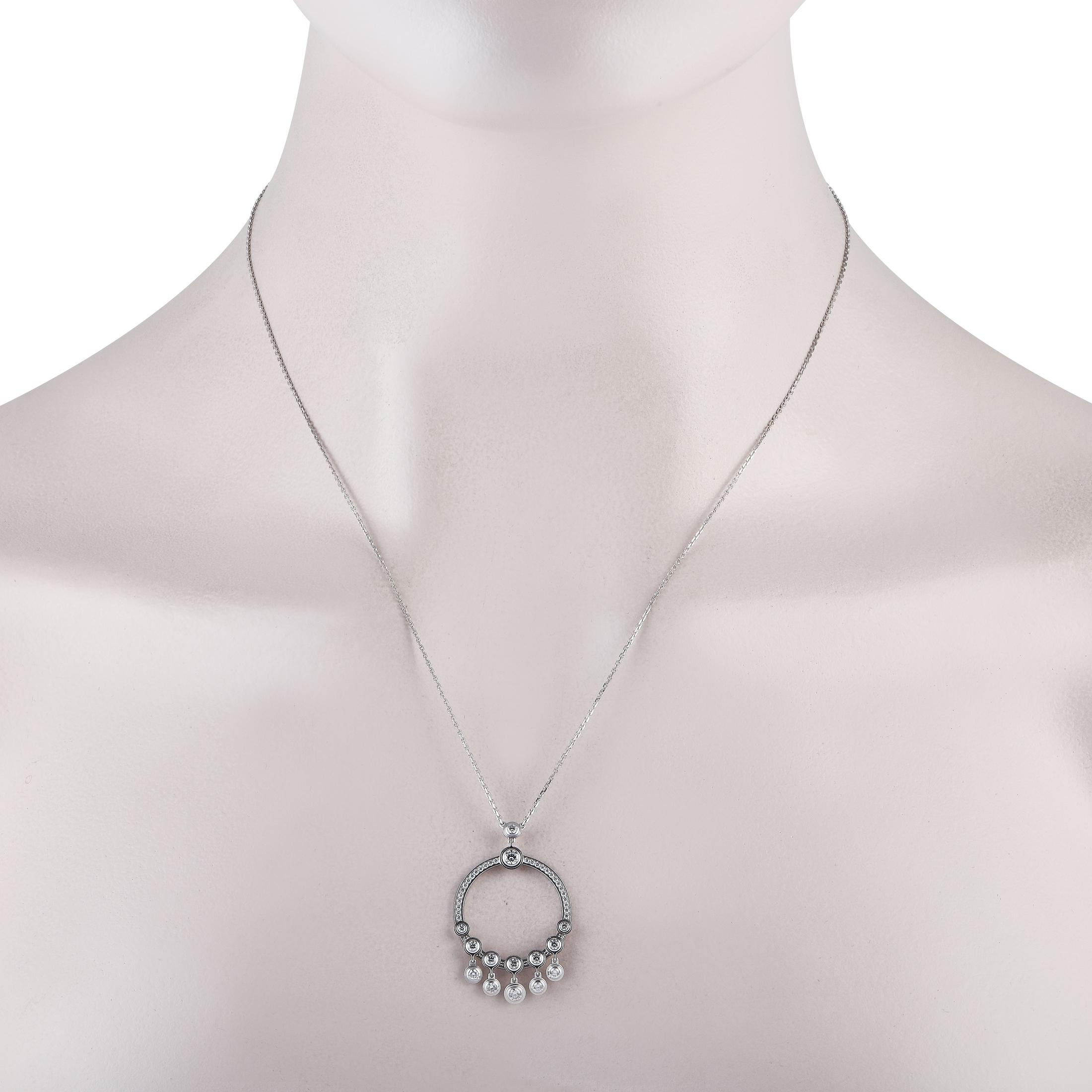 A glittering jewel to round out your looks. This Cartier necklace in 18K white gold features a hoop pendant traced with diamonds. The bottom half of the ring features more diamonds in bezel setting plus five more dangling bezel-set diamonds. The