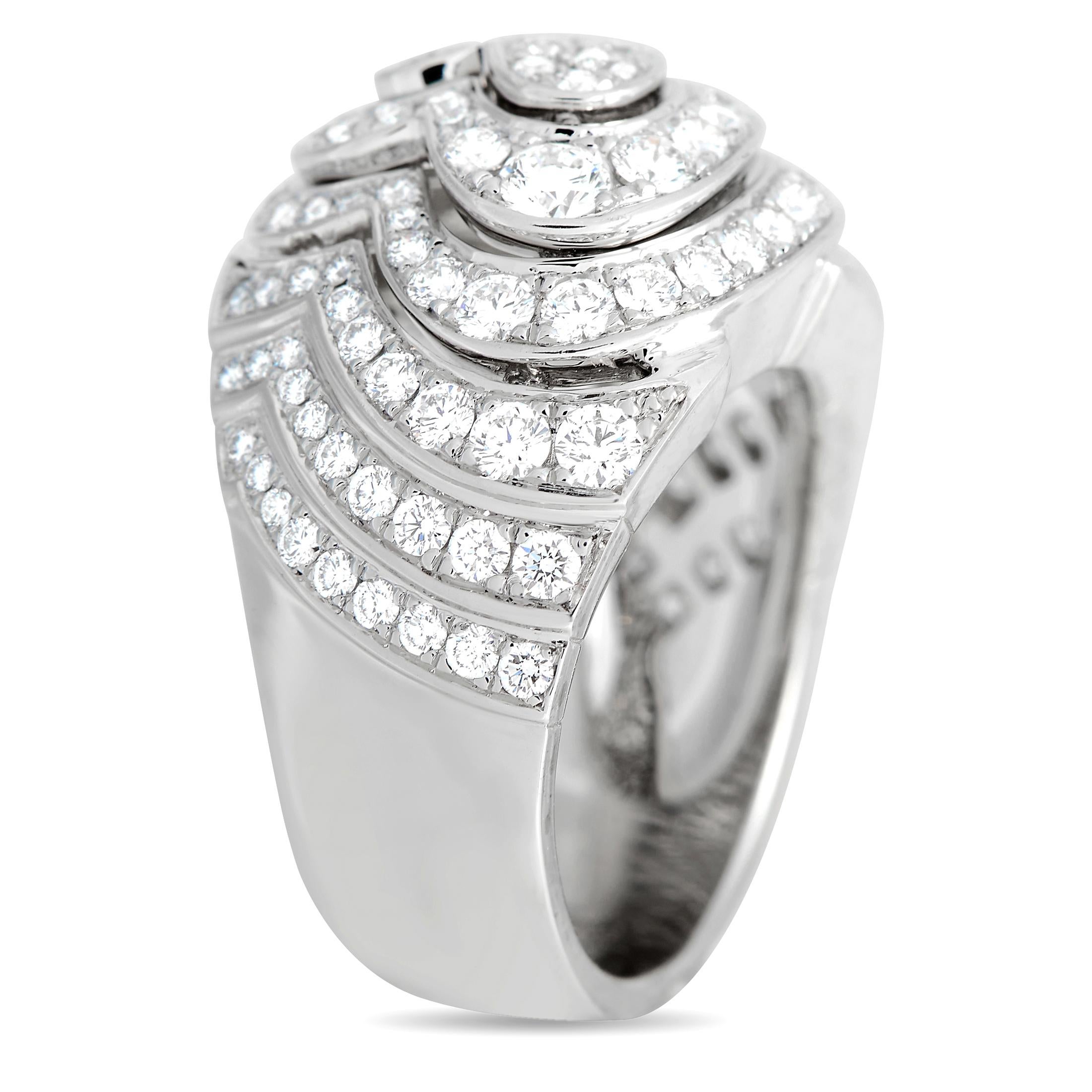 No doubt, this cocktail ring will be a precious addition to any lady's jewelry collection. This domed band from Cartier is meticulously crafted in 18K white gold. It is embellished with brilliant-cut diamonds set in a concentric heart pattern. This