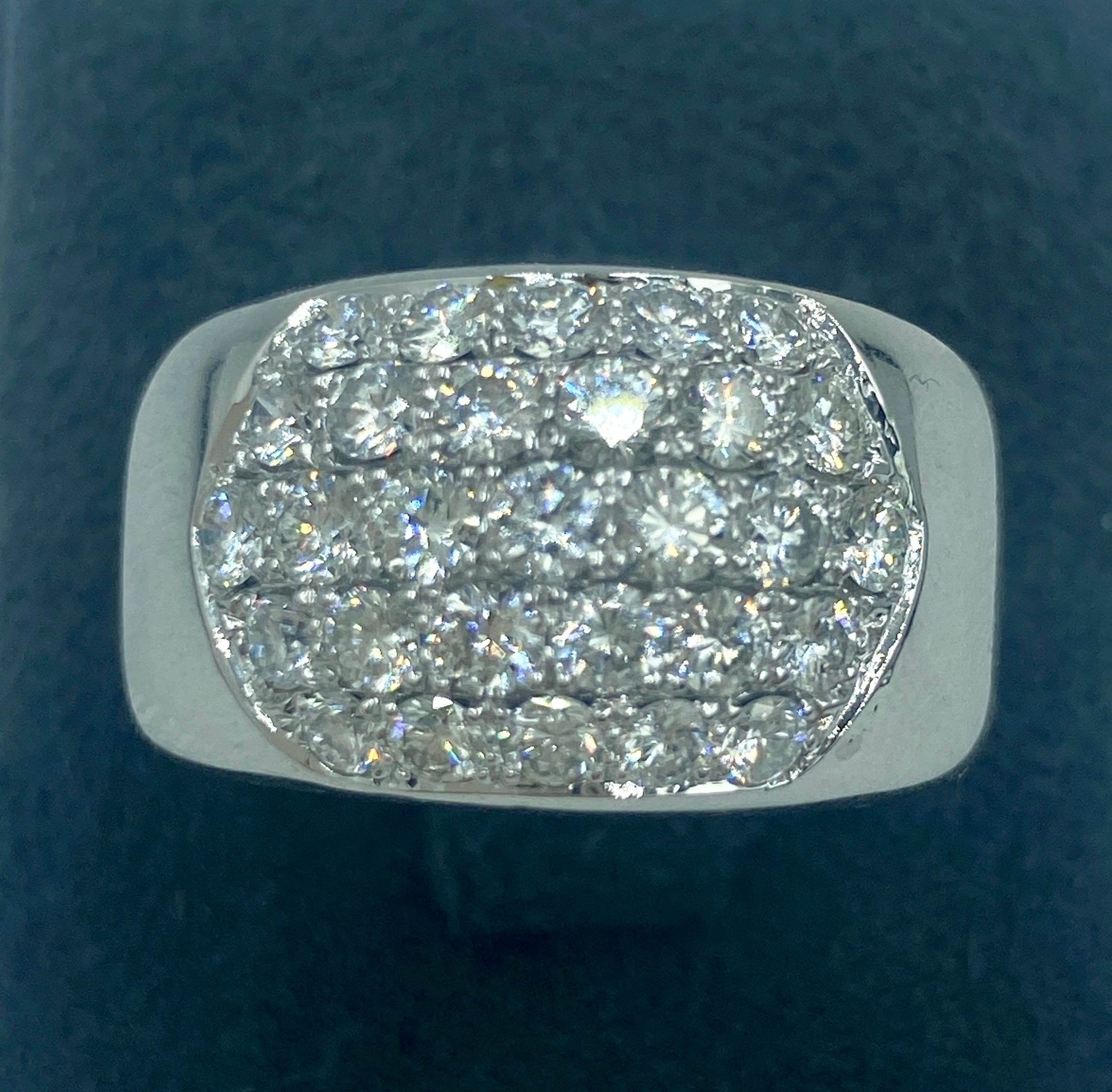 This Cartier ring marked 1997 is made of 18k white gold and has 5 rows of round cut diamonds. It is a timeless classic.