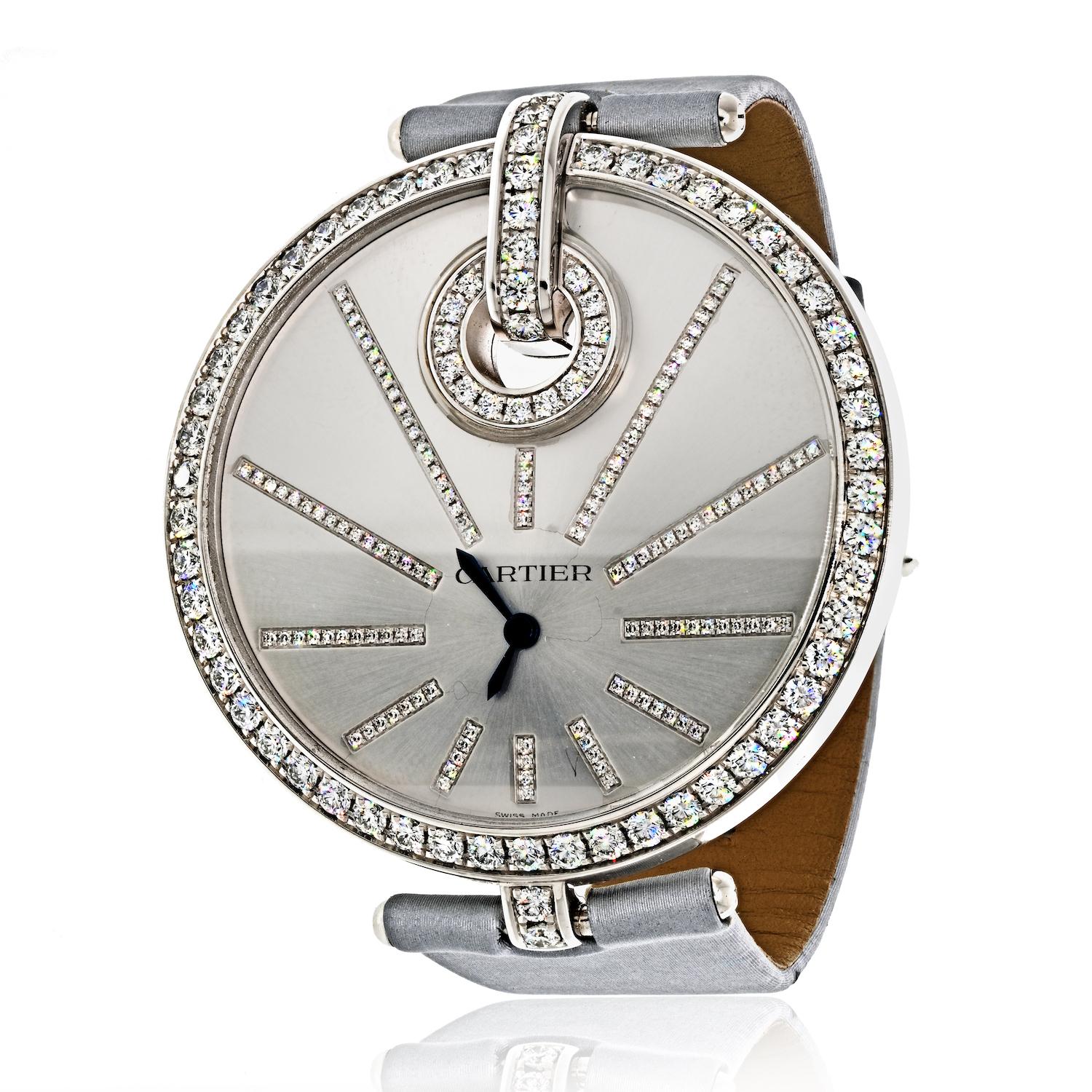 The Cartier ladies Captive diamond wristwatch is a stunning timepiece that exudes elegance and sophistication. The large round case, measuring approximately 50mm in diameter, features a bezel, dial, and buckle set with numerous round diamonds,