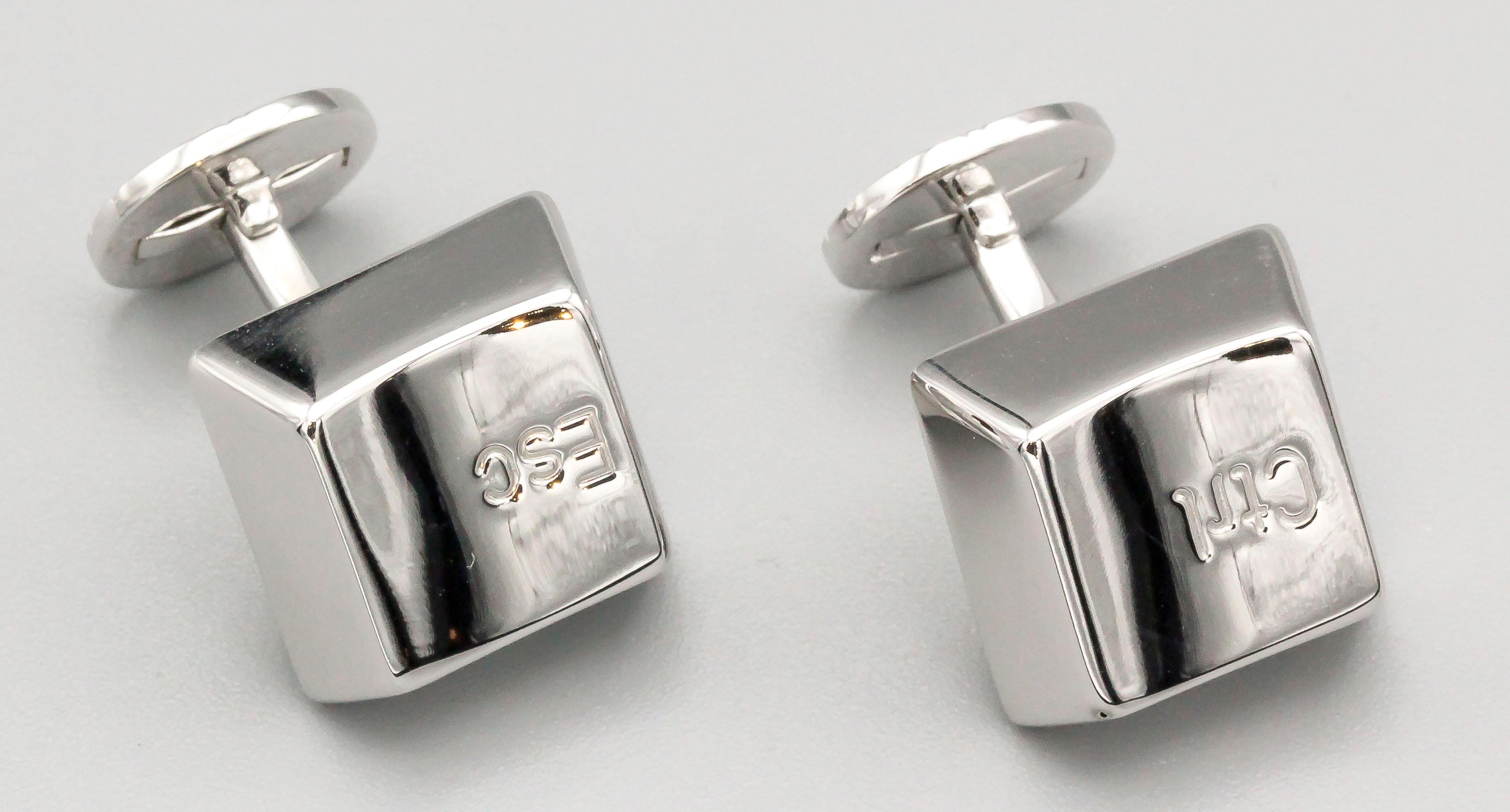 Unusual 18K white gold cufflinks by Cartier. They resemble computer keys, one side says 
