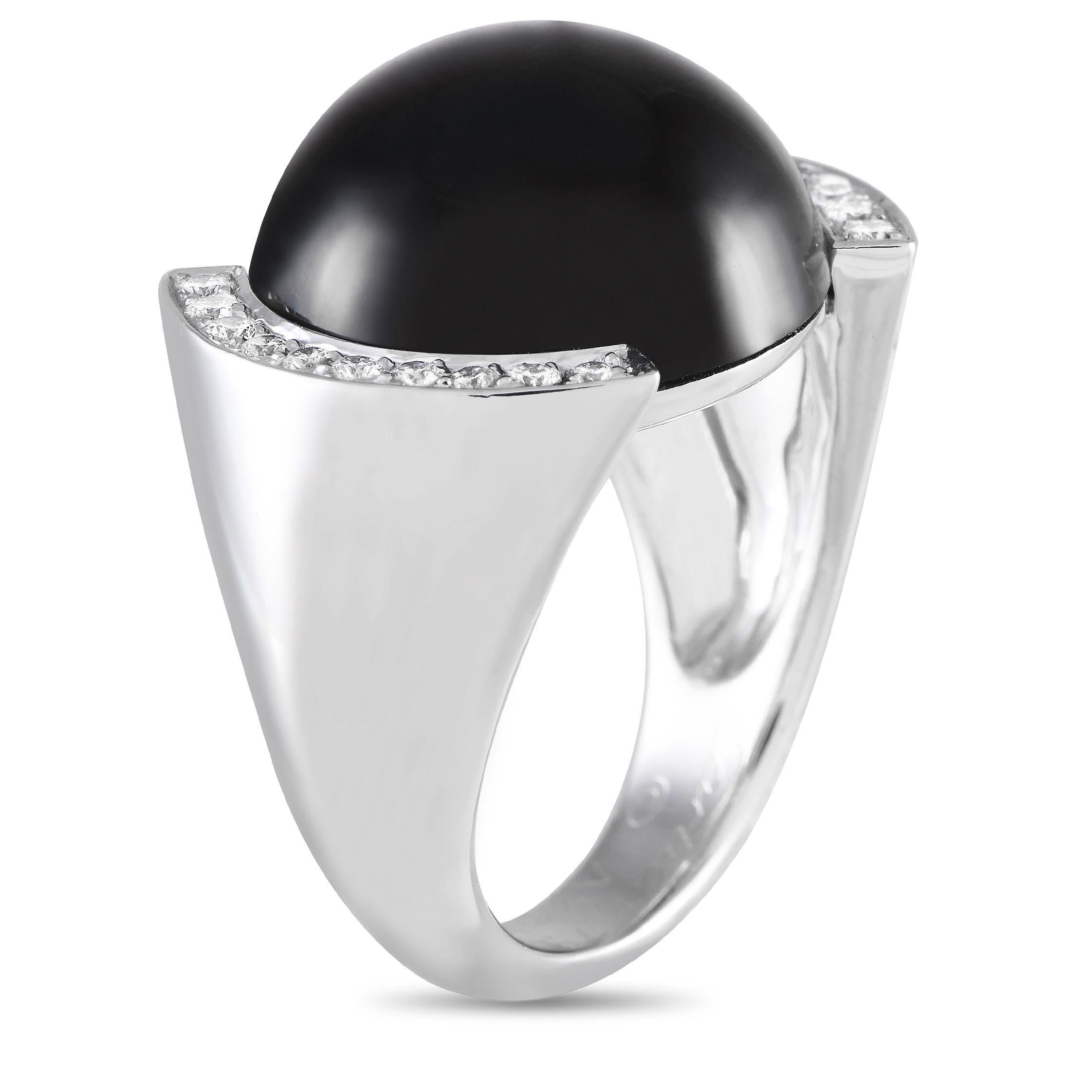 A daring yet refined cocktail ring from Maison de Cartier. This stunner features a striking smokey quartz cabochon framed by a diamond-encrusted half bezel. The 18K white gold band has wide, domed shoulders that taper as it nears the underside of