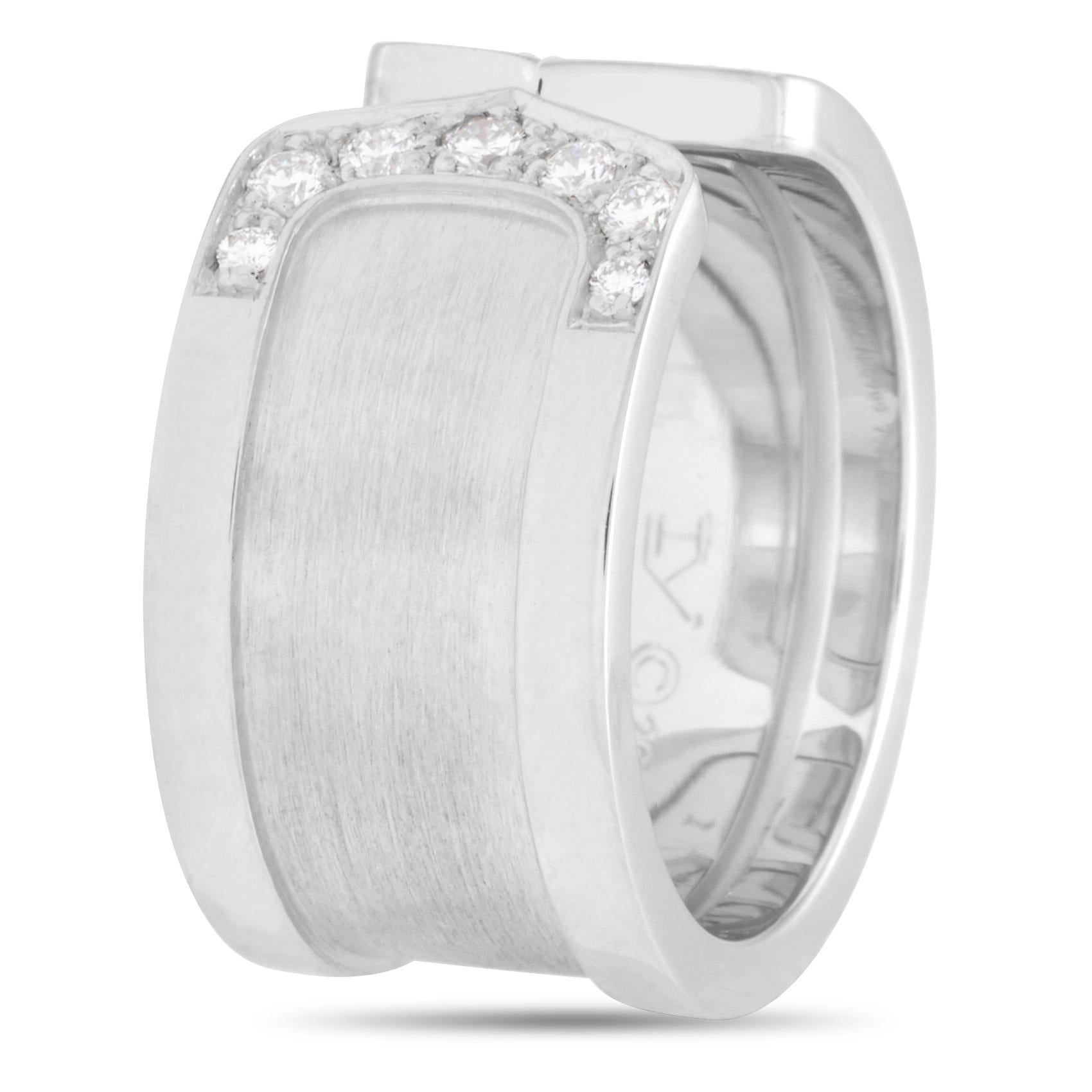 The Cartier Double C ring is made of 18K white gold and set with scintillating diamond stones. The ring weighs 10.8 grams and boasts band thickness of 5 mm.. The ring weighs 10.9 grams and boasts band thickness of 10 mm.

This jewelry piece is