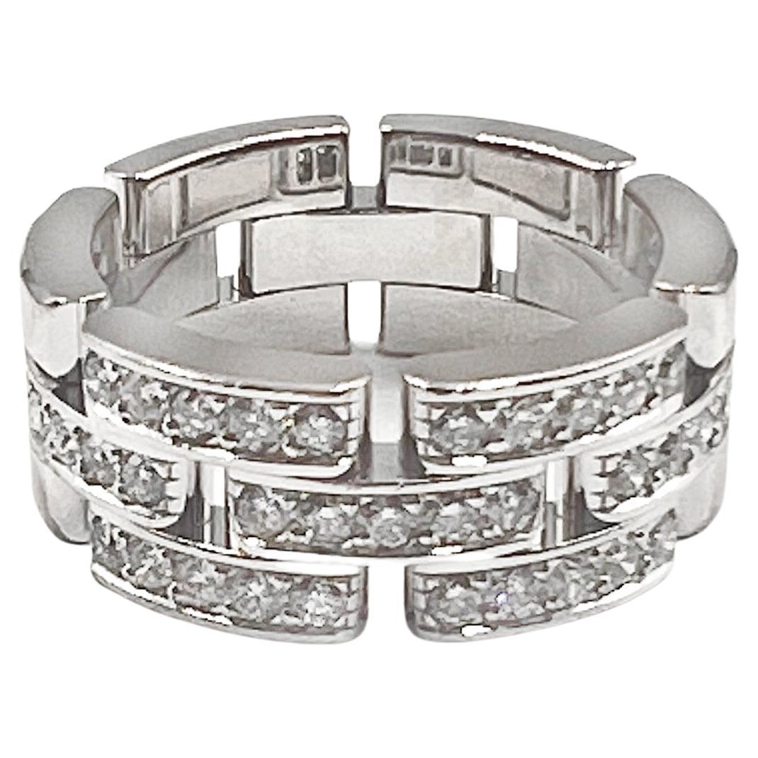 Cartier Maillon Panthere ring with round brilliant-cut diamonds set halfway around in polished 18k white gold. 35 round brilliant-cut diamonds weighing approximately 0.53 total carats. Measuring approximately 8mm in width. Signed 'Cartier ©' '750'