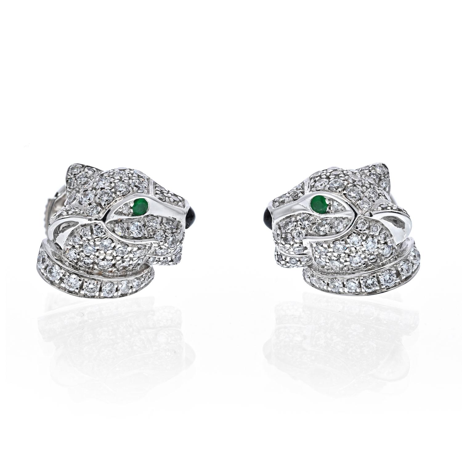 Each is designed as a panther's head set with diamonds, emerald eyes and onyx nose. 
A delightful pair of Cartier 18k gold diamond, emerald and onyx earrings from the Panthere de Cartier collection.

Metal: 18k white gold
Diamonds: 120 round