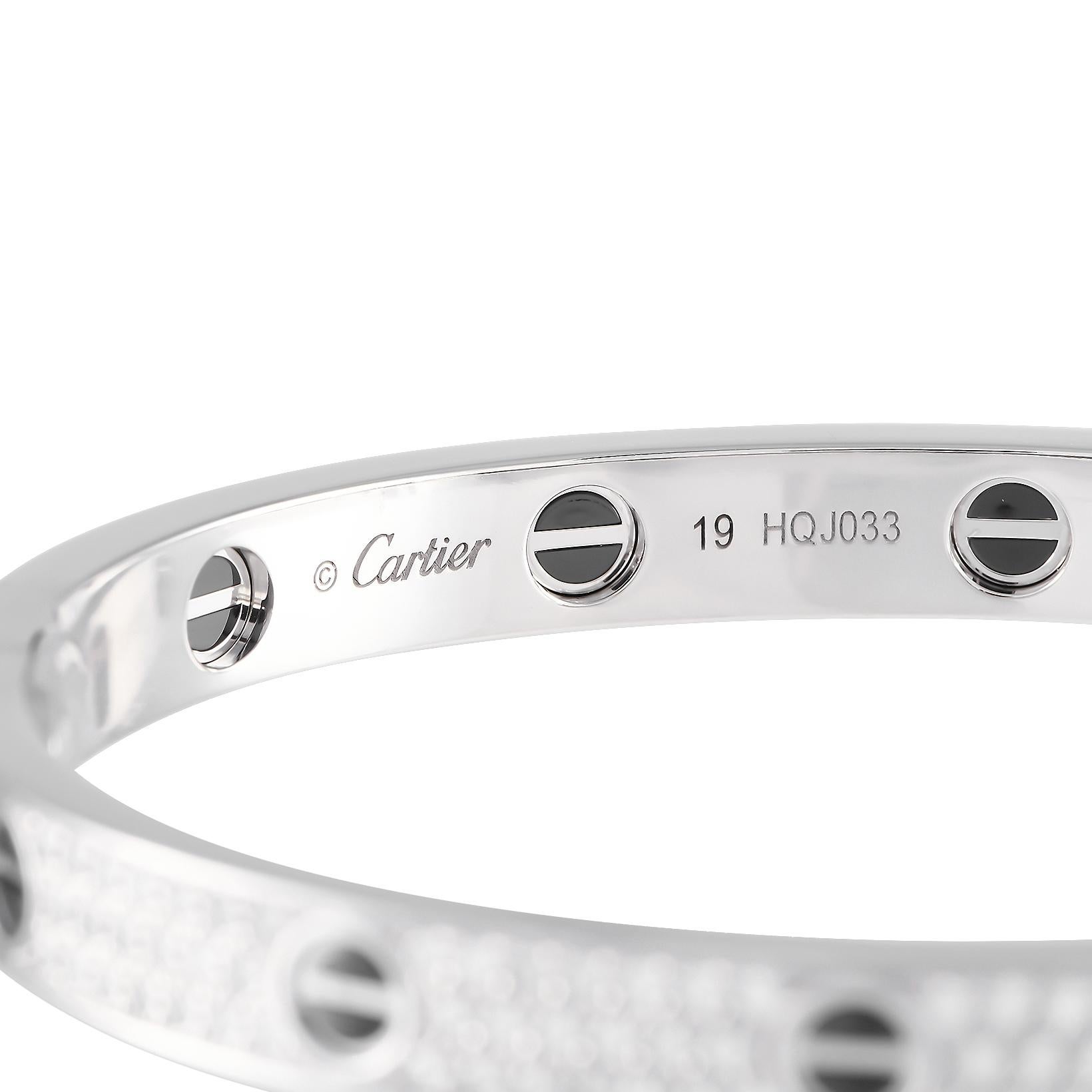 Glow with Cartier's diamond-paved LOVE bracelet. This 18K white gold stunner has the iconic screw motif in ceramic running along its diamond-encrusted circumference. The bracelet measures 7.1 inches.
Offered in estate condition, this size 18 Cartier