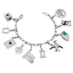 CARTIER 18K White Gold, Diamond, Turquoise, Ruby and Enamel 10-Charm Bracelet