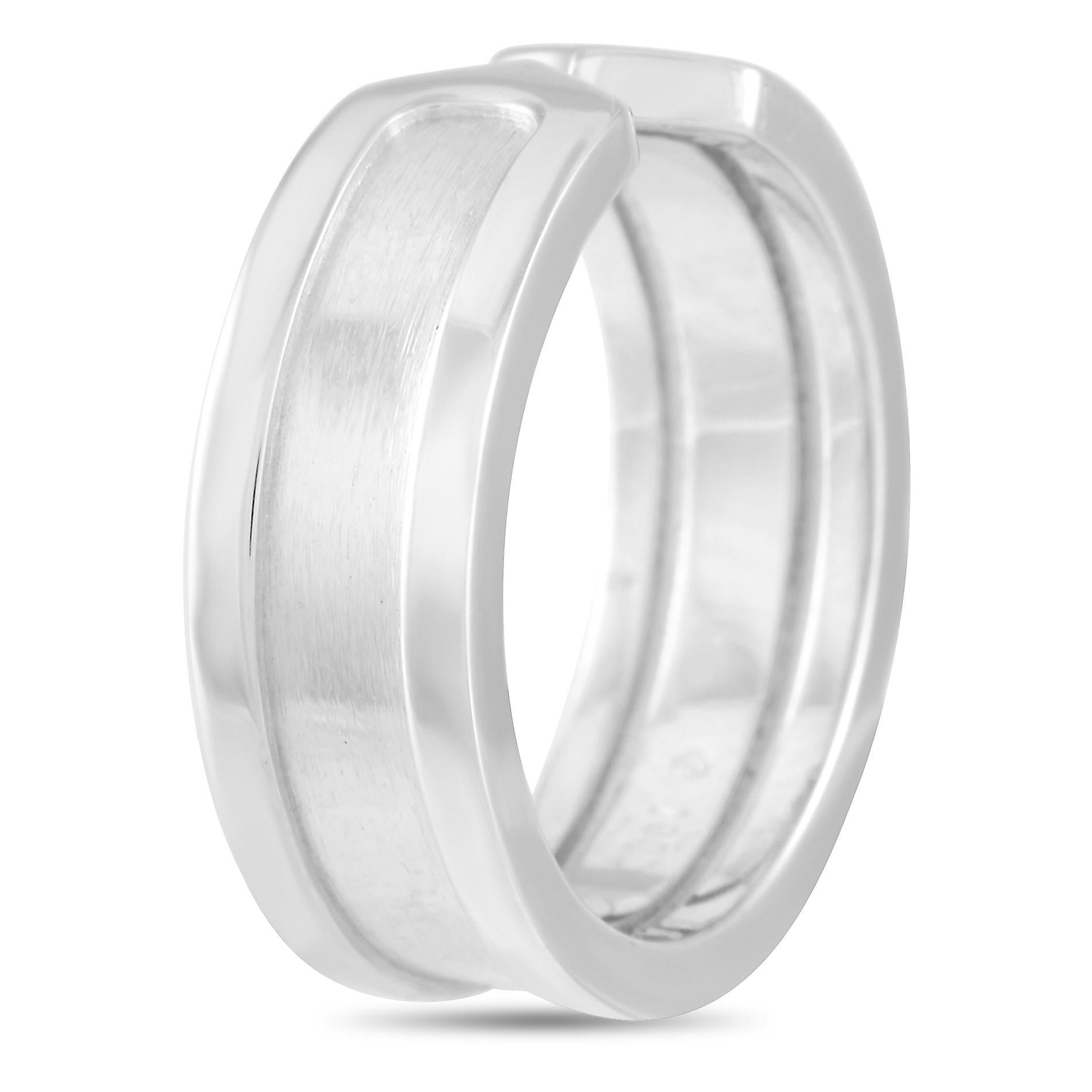 The Cartier 18K White Gold  Double C Ring is a classy ring with a simple yet timeless design. The double C logo is sculpted at the sides of each opening. The ring has a Cartier signature inside the shank. This is one Cartier classic that you will