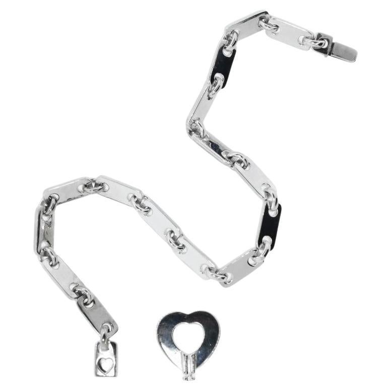 Cartier 18K White Gold Fidelity Love Link Bracelet with the Heart Key.