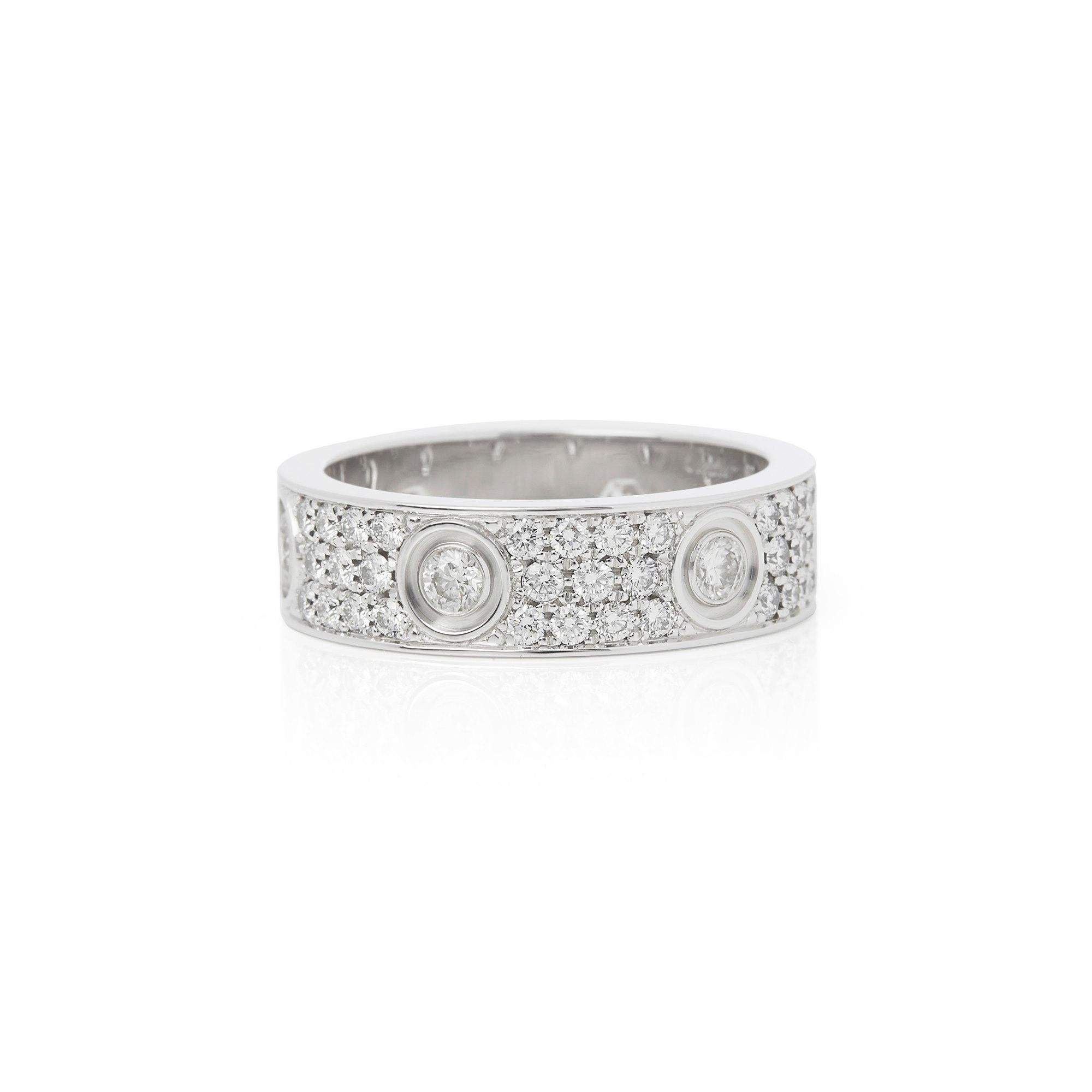 This Ring by Cartier is from their Signature Love collection and features Six Round Brilliant Cut Diamonds intermittently set with Sixty Six Round Brilliant Cut Diamonds Pave set in between them. Mounted in an 18k White Gold. Finger Size UK R 1/2,