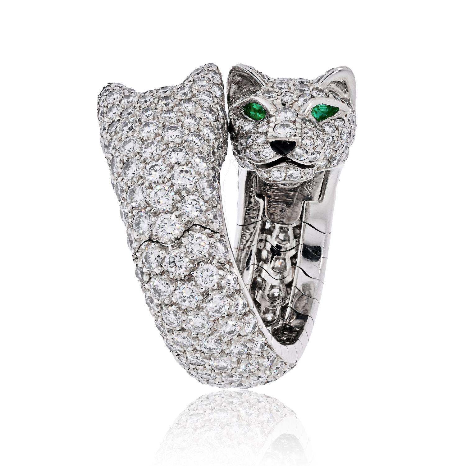 Cartier Panthere Ring, with double Lakarda diamond panthers facing each other. The Panthere de Cartier ring, made in 18K white gold, set with 356 brilliant-cut diamonds, totaling 5.04cts.
Eyes and nose: emeralds, onyx. 
Serial 9387**.
With a Cartier
