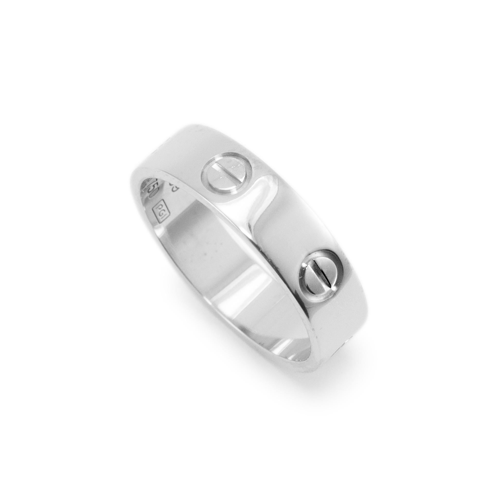 Brand: Cartier

Gender: Unisex

Metal Type: 18K White Gold

Size: 8.75

Width: 5.50 mm

Weight: 6.66 Grams

Designer made polished 18K white gold, ring with a soft-square shank. The metal was tested and determined to be 18K white gold. Engraved with