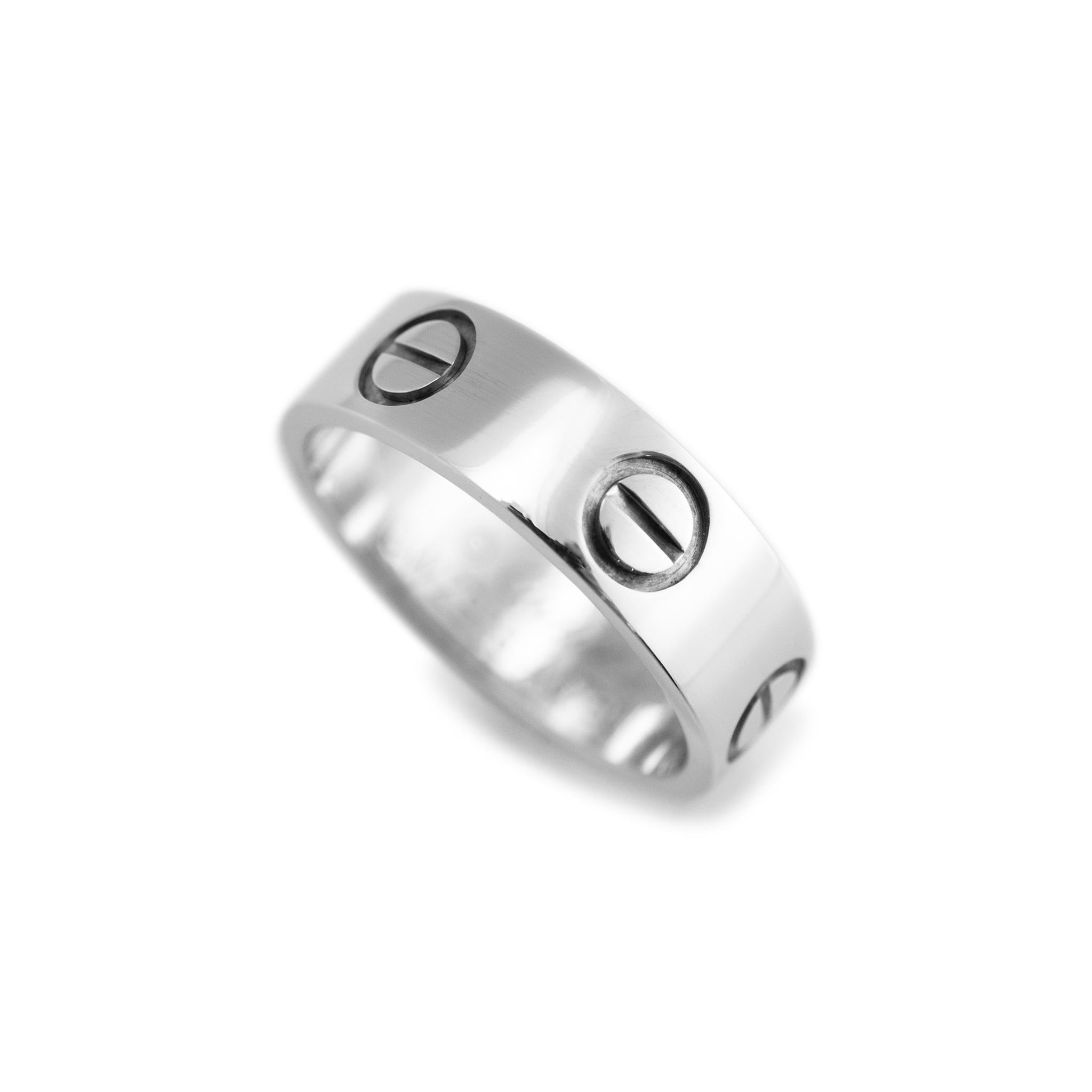 Brand: Cartier

Gender: Ladies

Metal Type: 18K White Gold

Ring Size: 5

Width: 5.20 mm

Weight: 5.15 grams

Ladies 18K white gold comfort-fit band with a soft-square shank. The metal was tested and determined to be 18K white gold. Engraved with