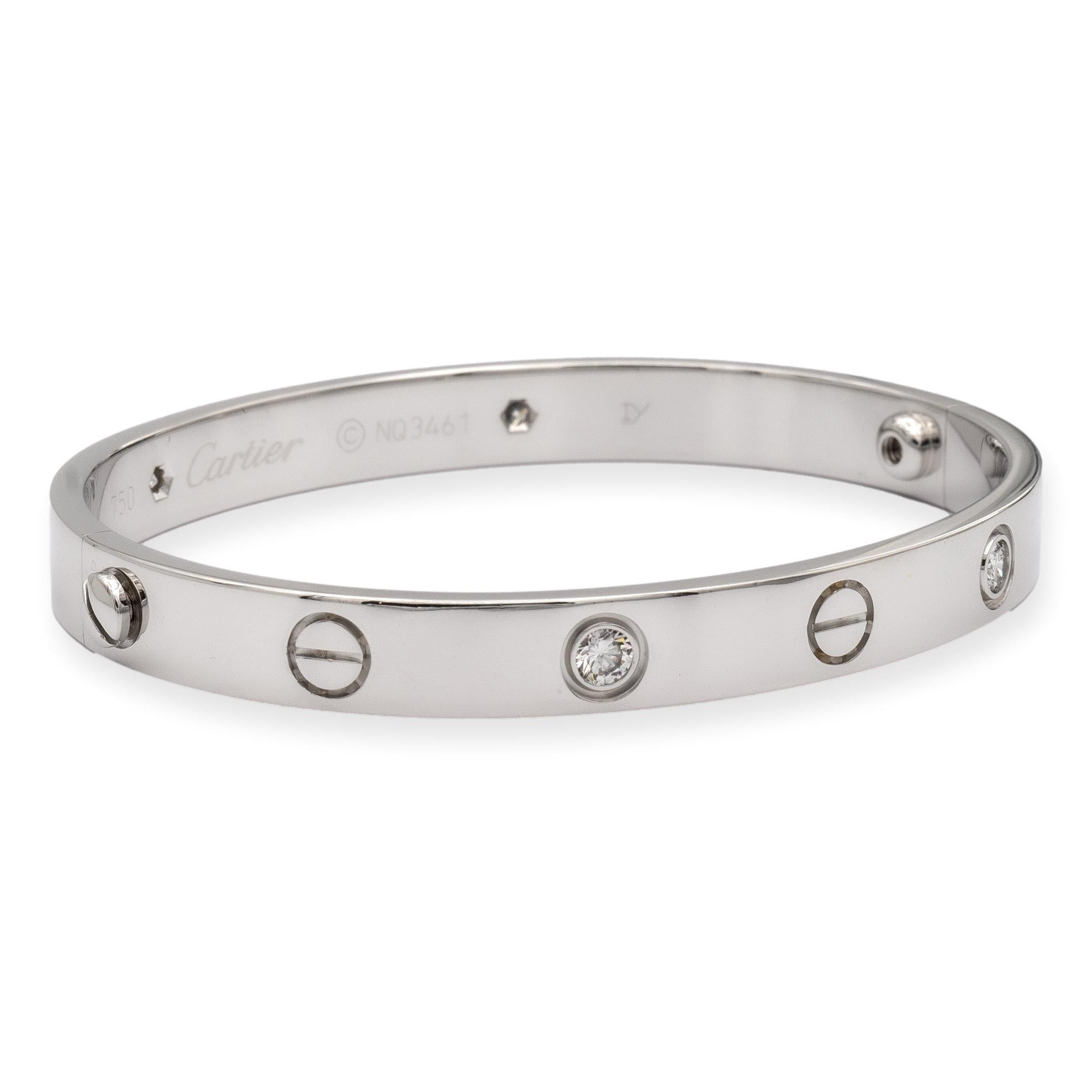 Cartier bangle bracelet from the iconic Love collection finely crafted in 18 karat white gold featuring 4 round brilliant cut diamonds weighing 0.42 cts. total weight. These diamonds are of exceptional quality, with a brilliant cut and excellent