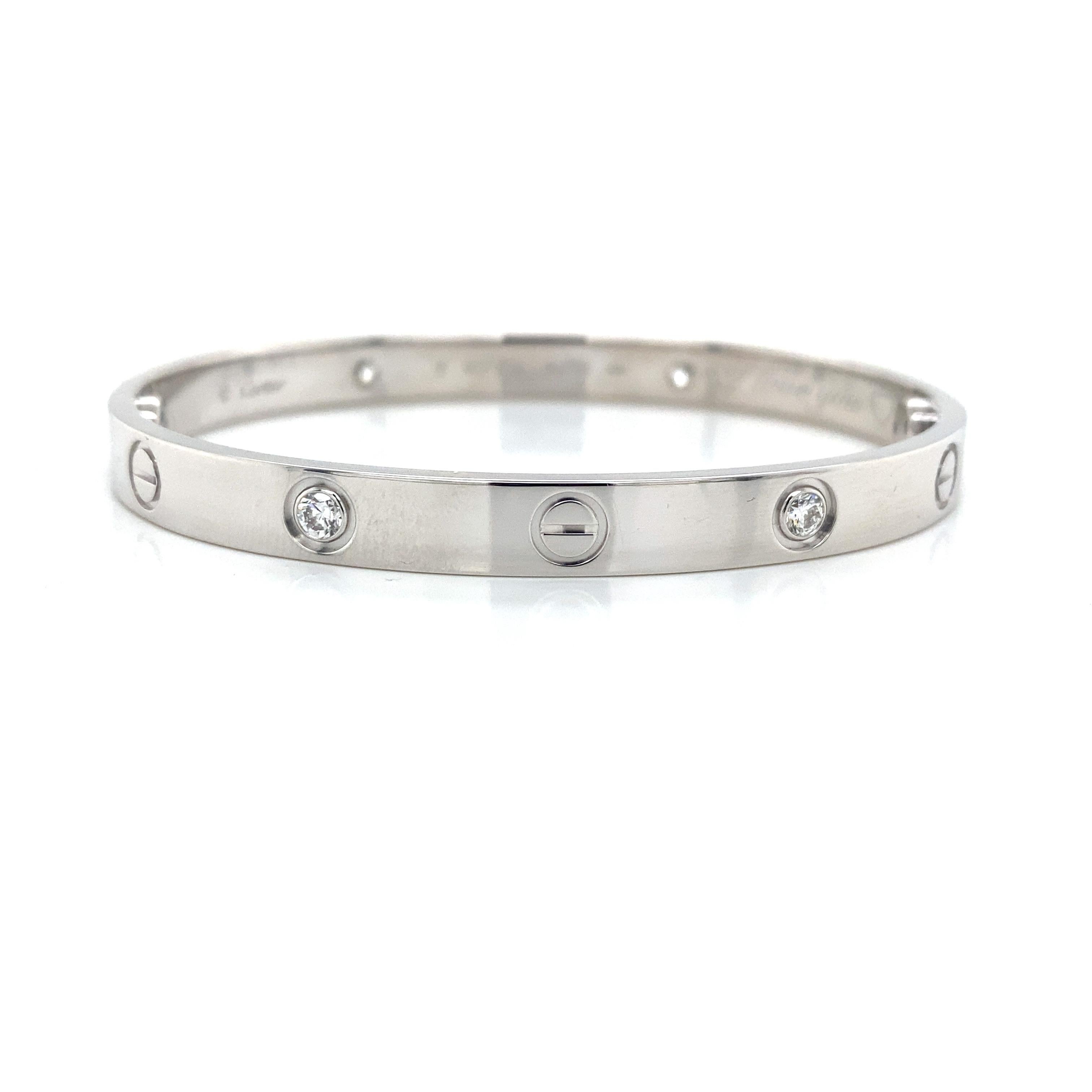 Cartier Love Bracelet in 18K White Gold.  (4) Round Brilliant Cut Diamonds weighing 0.42 carat total weight, F-G in color, VVS1 are bezel set in this classic Bangle.  Size 17.  36 grams.   Screwdriver and Cartier Certificate papers included. 