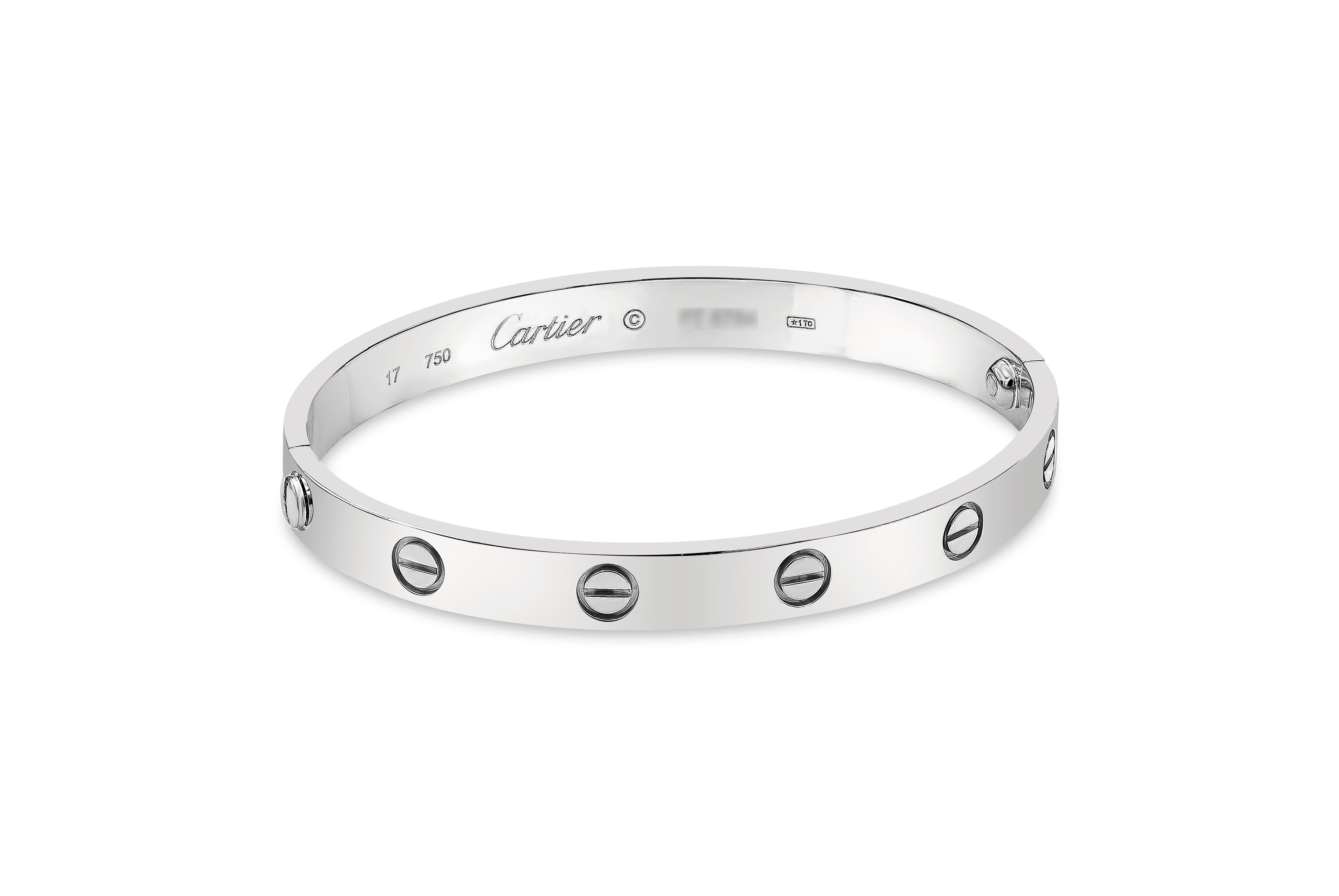 A classic bracelet made and signed by Cartier. Love Bracelet design. Size 17. Made in 18 karat white gold. In original box. In excellent condition. Lightly polished. 
