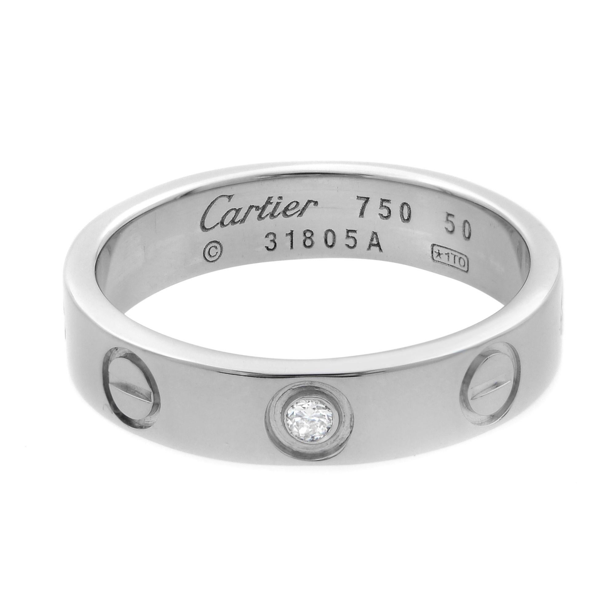 Cartier Love wedding band, 18K white gold, set with 1 brilliant-cut diamond totaling 0.02 carats. Width: 4mm. Size 50 US 5.5. Excellent pre-owned condition, original box and papers are not included.