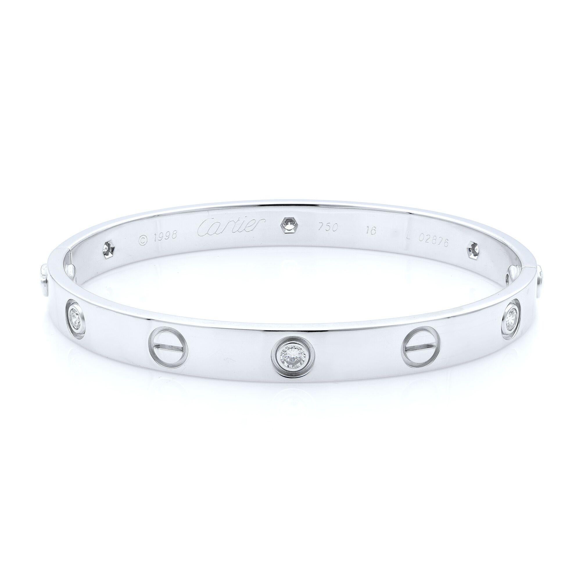 Cartier Love six diamond bangle bracelet in 18K white gold. Old screw system.
Pre-owned, with old screw style closure. Looks great. Comes with screwdriver and box, papers are not included.
Size: 16