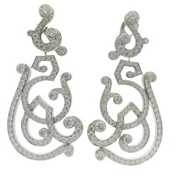 Boucles d'oreilles jour et nuit en or blanc 18 carats et pavés de Cartier