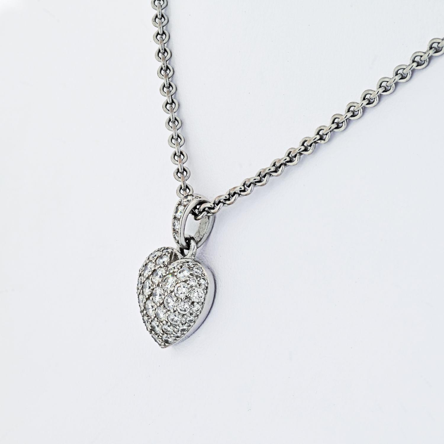 Pavé diamond 'puffed' heart pendant, with a diamond-set bale, mounted in 18k white gold, on a 16.5