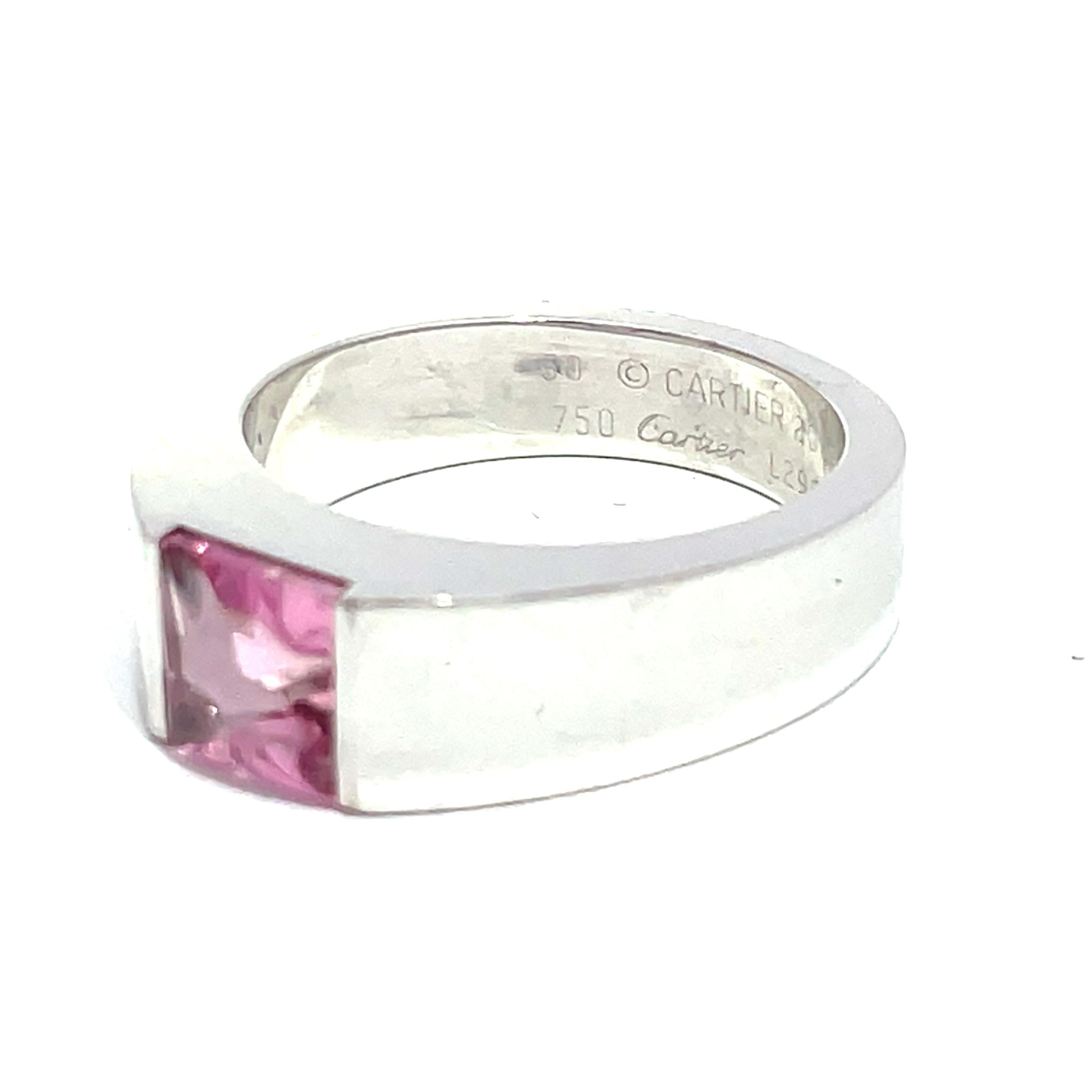 Discover the exquisite elegance of the Cartier Tank Ring, a stunning piece that embodies sophistication and timeless beauty. Crafted from luxurious 18k white gold, this ring features a captivating pink tourmaline stone that radiates a soft,