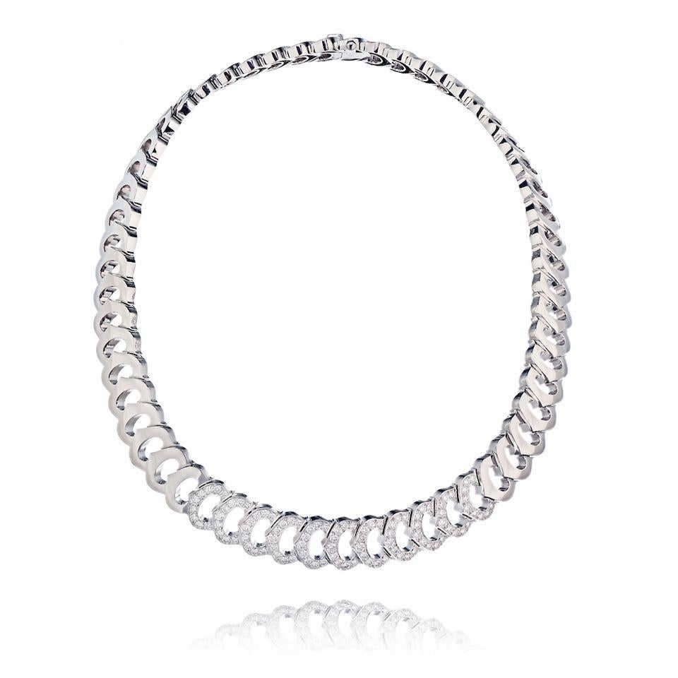 Cartier 'C' logo necklace, crafted in 18 karat white gold. 

This necklace is circa the 1980s and is in excellent original condition and was recently professionally cleaned and polished.

Weight: 123 grams
Diamonds: 99 round brilliant cuts 2.65cts