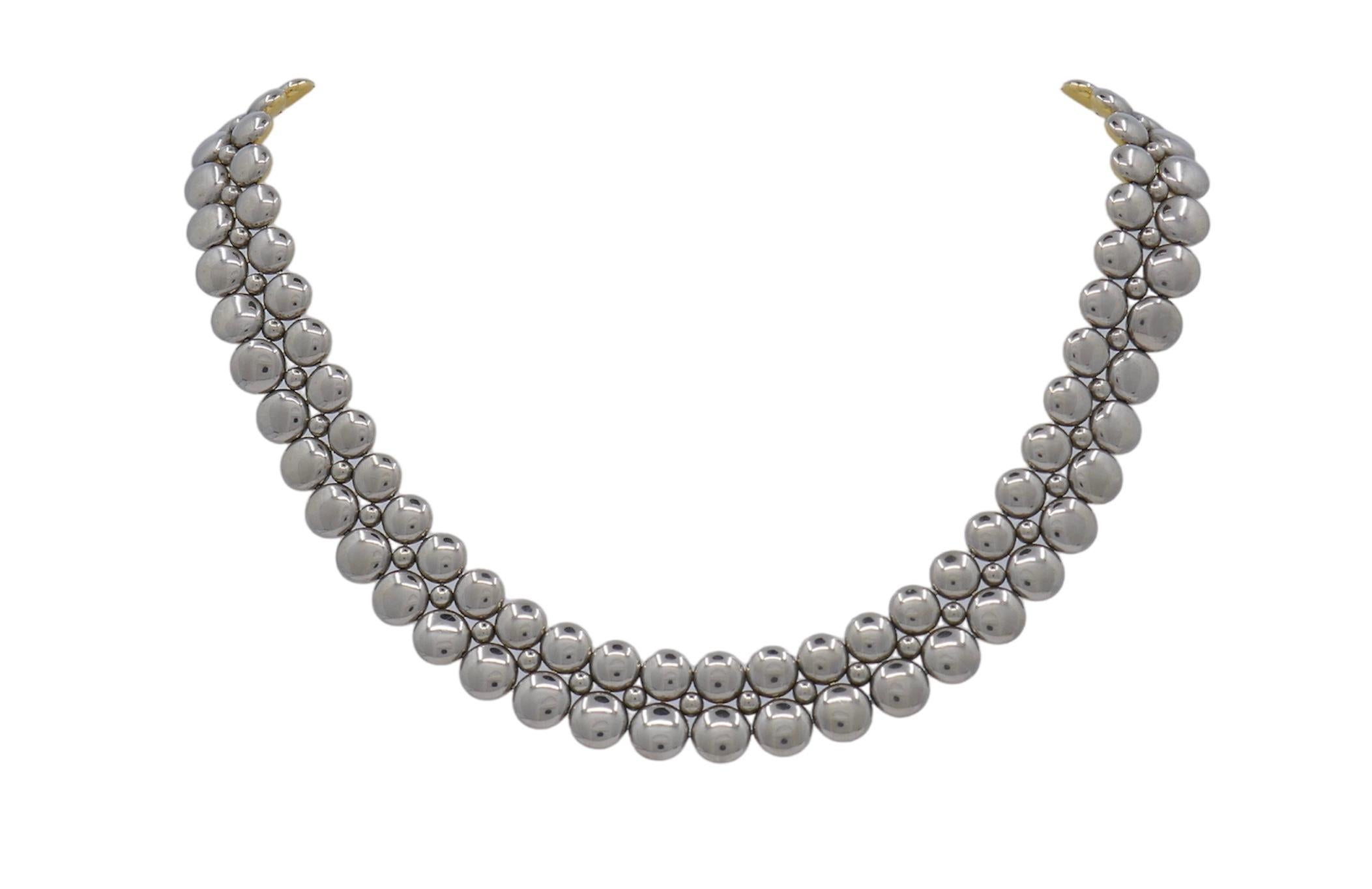 Fabulous design from famed jewelry house Cartier. This necklace is from the Honeymoon collection and crafted in solid 18k gold. The necklace is a unique design as it is  reversible.  One side crafted in yellow gold and the other crafted in white