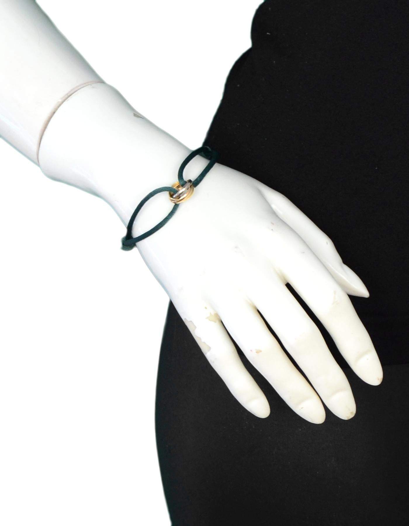 Cartier 18k White/Yellow/Pink Gold Trinity Bracelet w/ Green Cord
Color: Green, gold
Materials: 18k yellow, rose and white gold
Hallmarks: 750 HN 0289 SNOE
Closure/Opening: Slide on
Overall Condition: Excellent pre-owned condition
Estimated Retail: