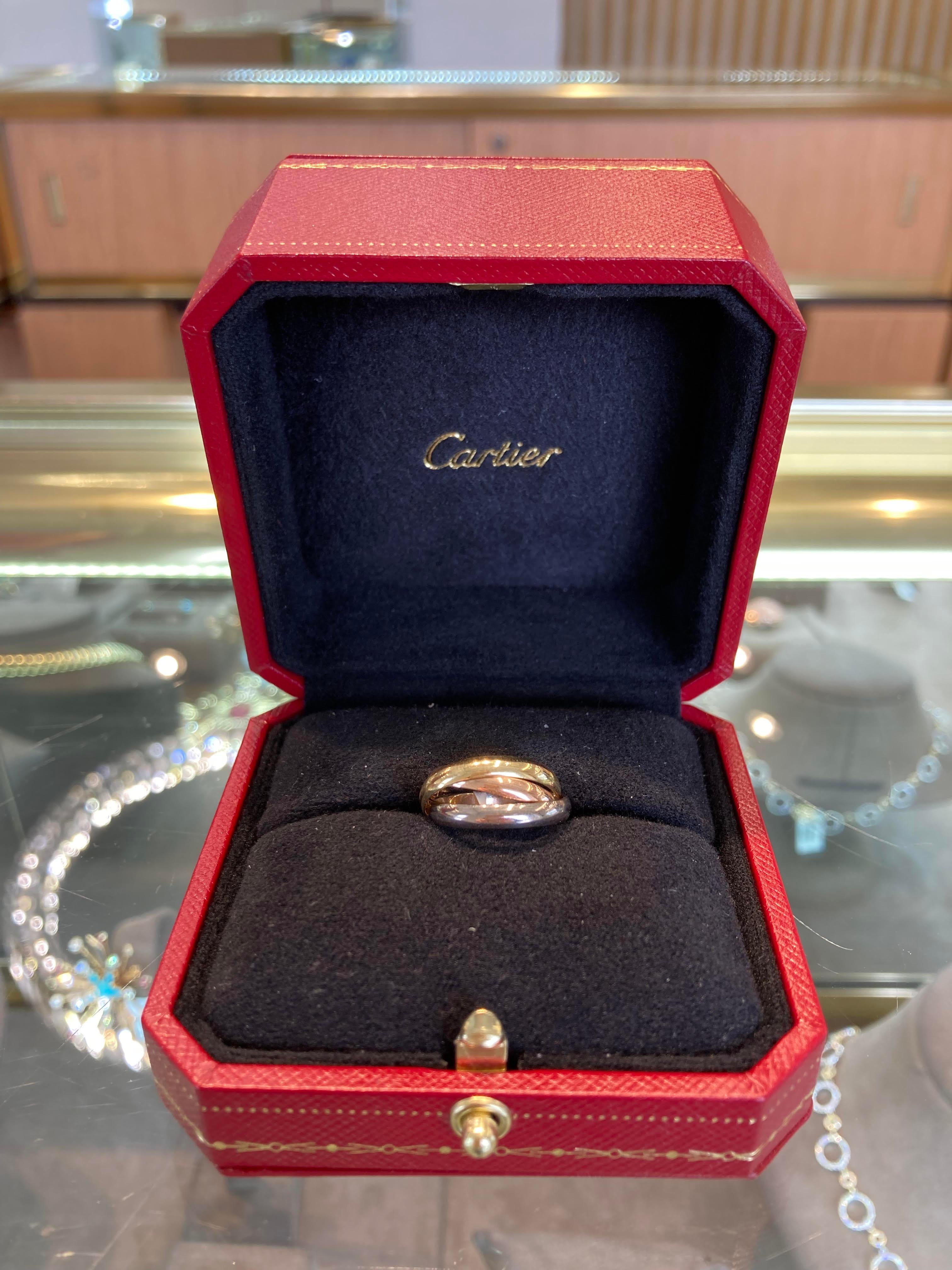 Cartier 
18K White, Yellow, Rose Gold Rolling Ring
Box and Paperwork