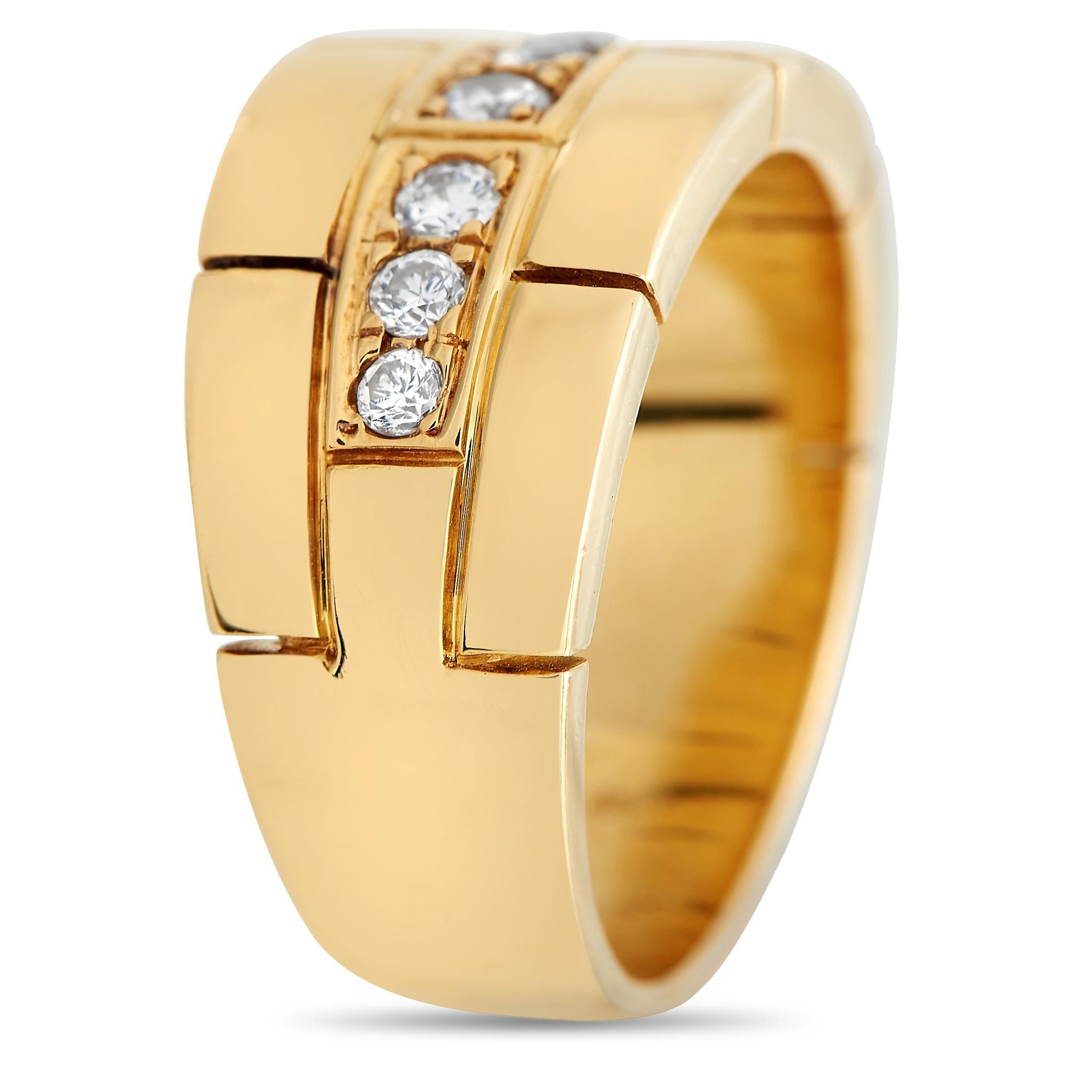 A series of inset diamonds totaling 0.40 carats make a statement at the center of this refined ring from Cartier. The 18K Yellow Gold band measures 6mm wide and includes engraved accents for added visual impact. A top height measuring 2mm gives it a