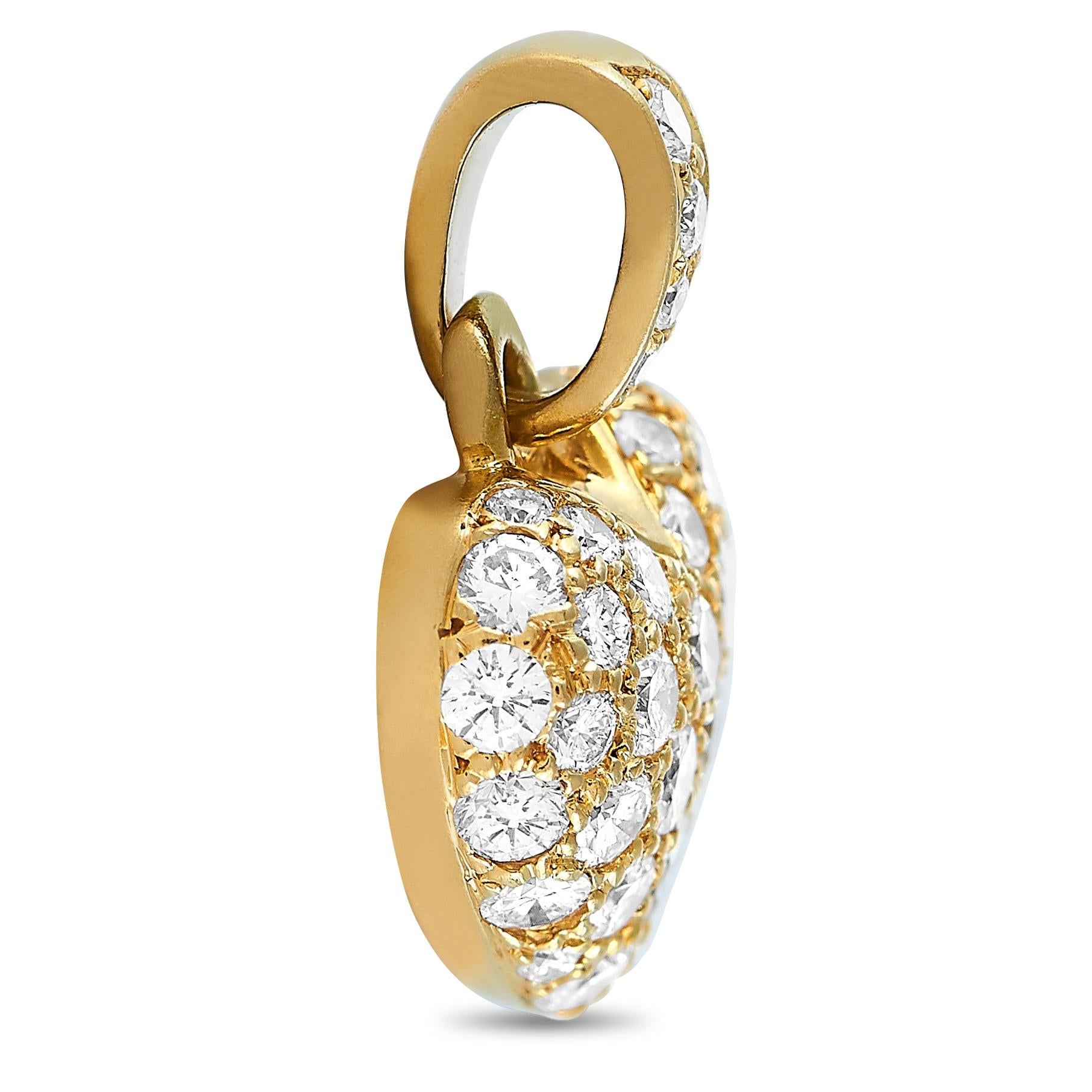 This Cartier heart pendant is crafted from 18K yellow gold and set with diamonds that total 0.65 carats. The pendant weighs 1.5 grams and measures 0.62” in length and 0.45” in width.
 
 Offered in estate condition, this item includes the