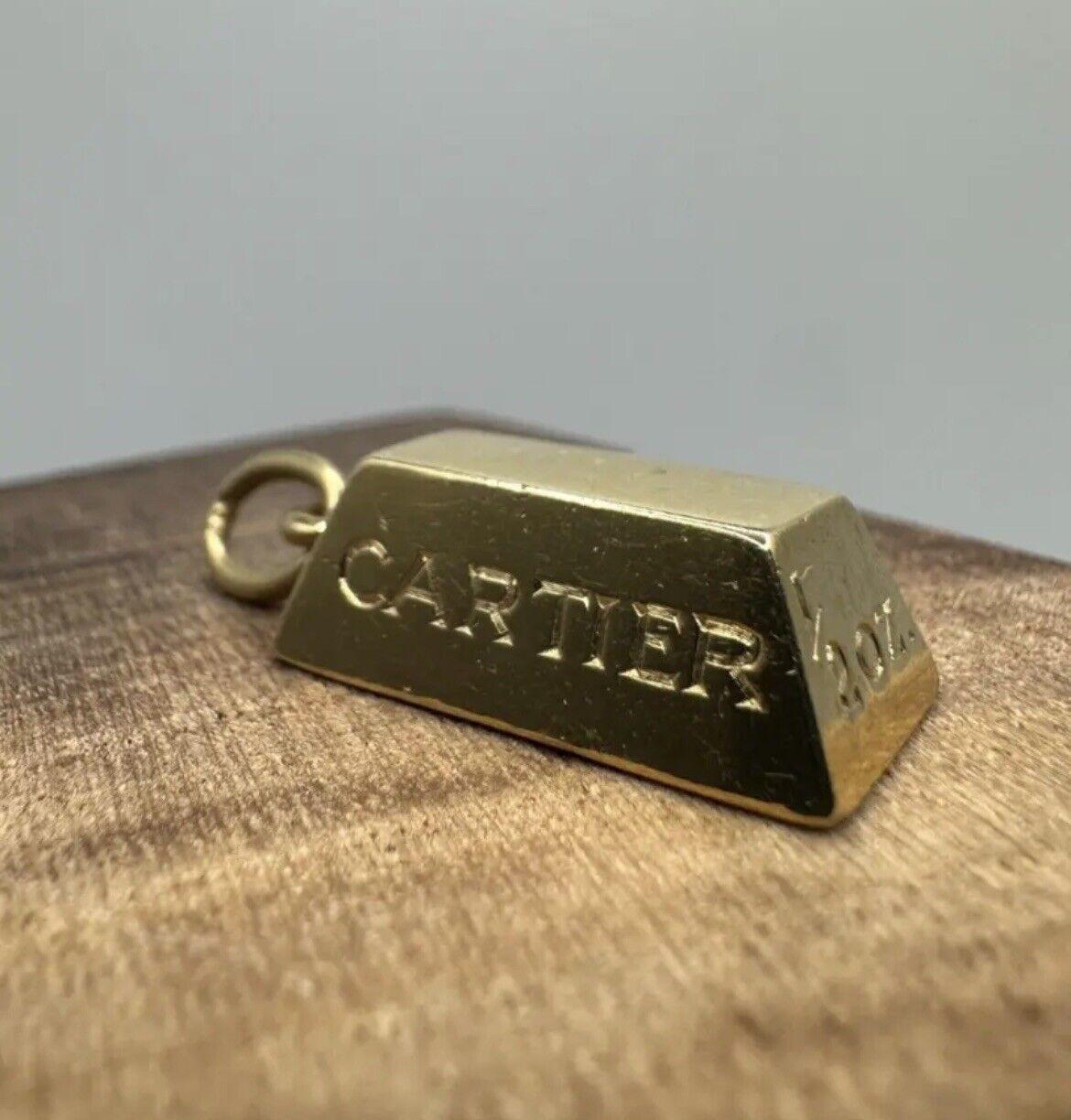 Cartier 18k Yellow Gold 1/z Oz Ingot Bar Charm Pendant Vintage Circa 1970s

Here is your chance to purchase a beautiful and highly collectible designer pendant.   

Made by Cartier in the 1970s, these ingot charms represent a gold bar! This one is