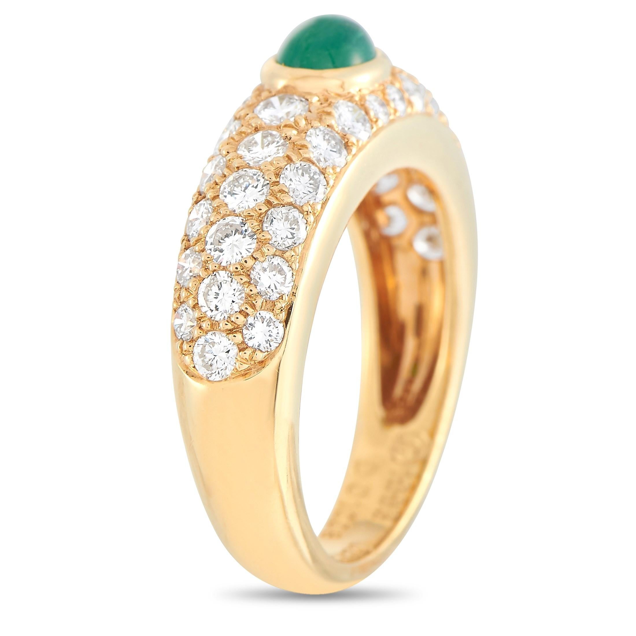 This Cartier 18K Yellow Gold 1.00 ct Diamond and Emerald Cabochon Ring is a dazzling vintage statement piece. The band is made with 18K yellow gold and set with numerous glittering round-cut diamonds throughout the band, that are E color, VS