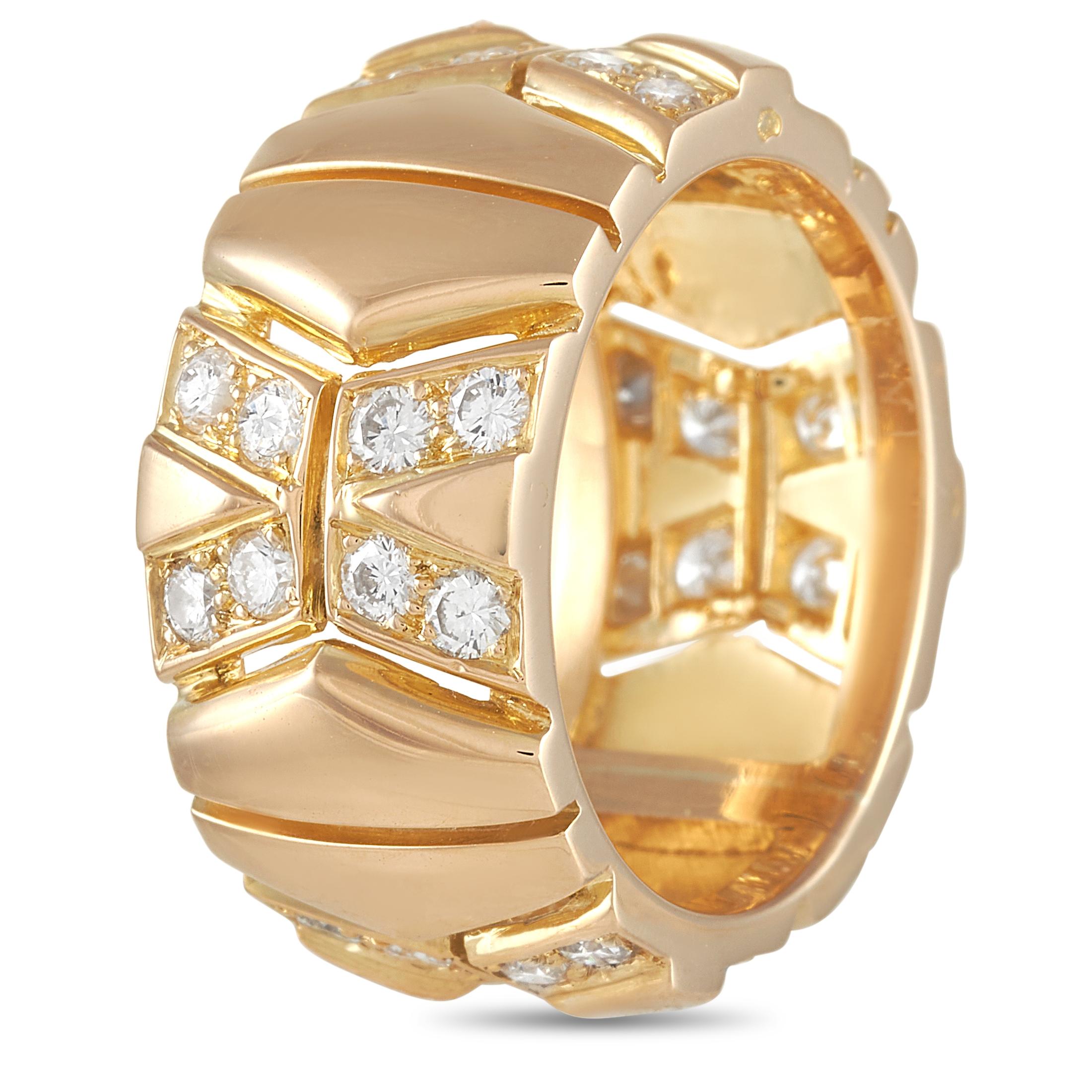This lovely Cartier 18K Yellow Gold 1.00 ct Diamond Band Ring is a statement piece. The ring is made with a thick 18K yellow gold band and set with 1.00 carats of round diamonds of E color and VVS Clarity in an X pattern spaced out around the band.
