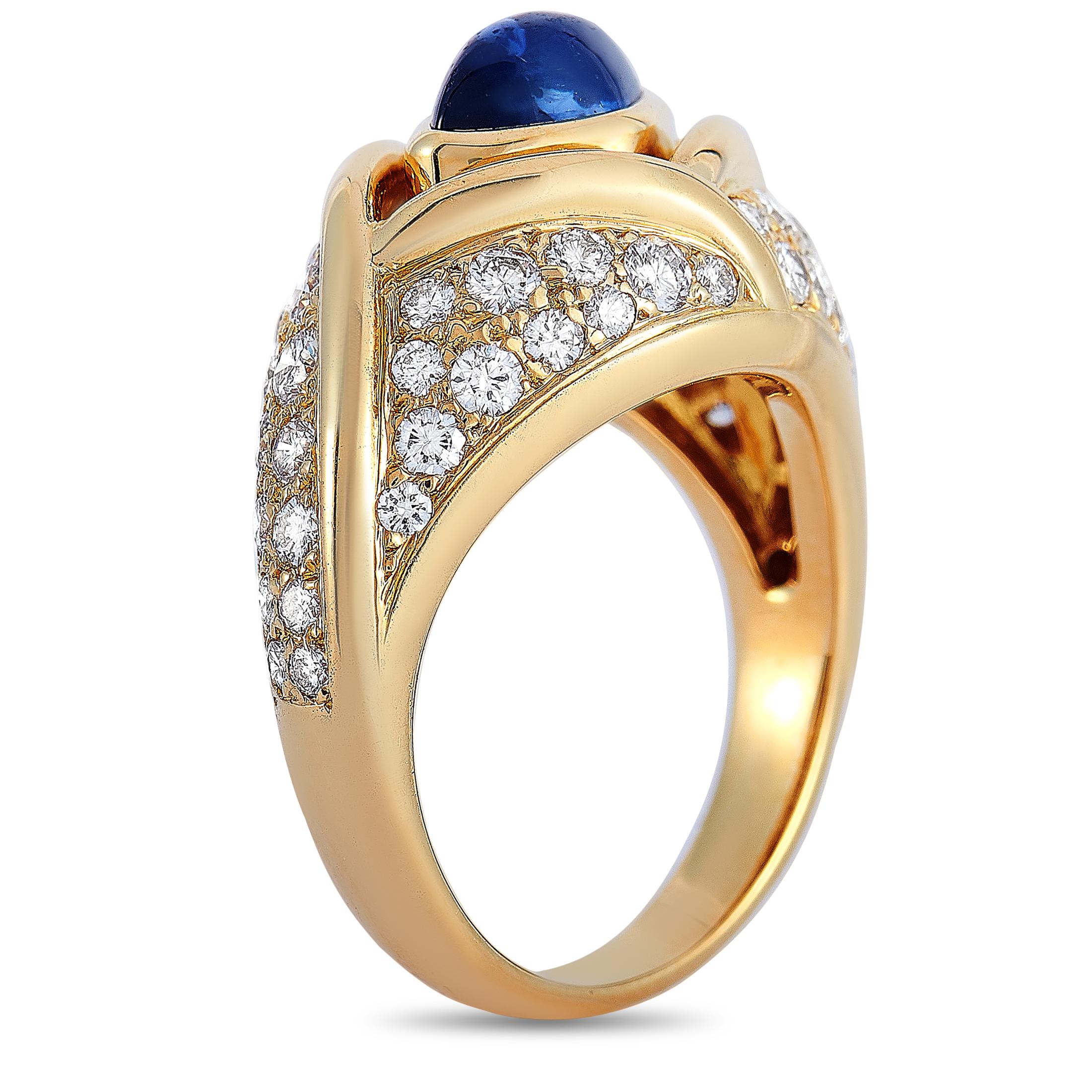 This Cartier ring is crafted from 18K yellow gold and weighs 9.8 grams, boasting band thickness of 3 mm and top height of 10 mm, while top dimensions measure 24 by 13 mm. The ring is set with a sapphire and a total of 1.10 carats of