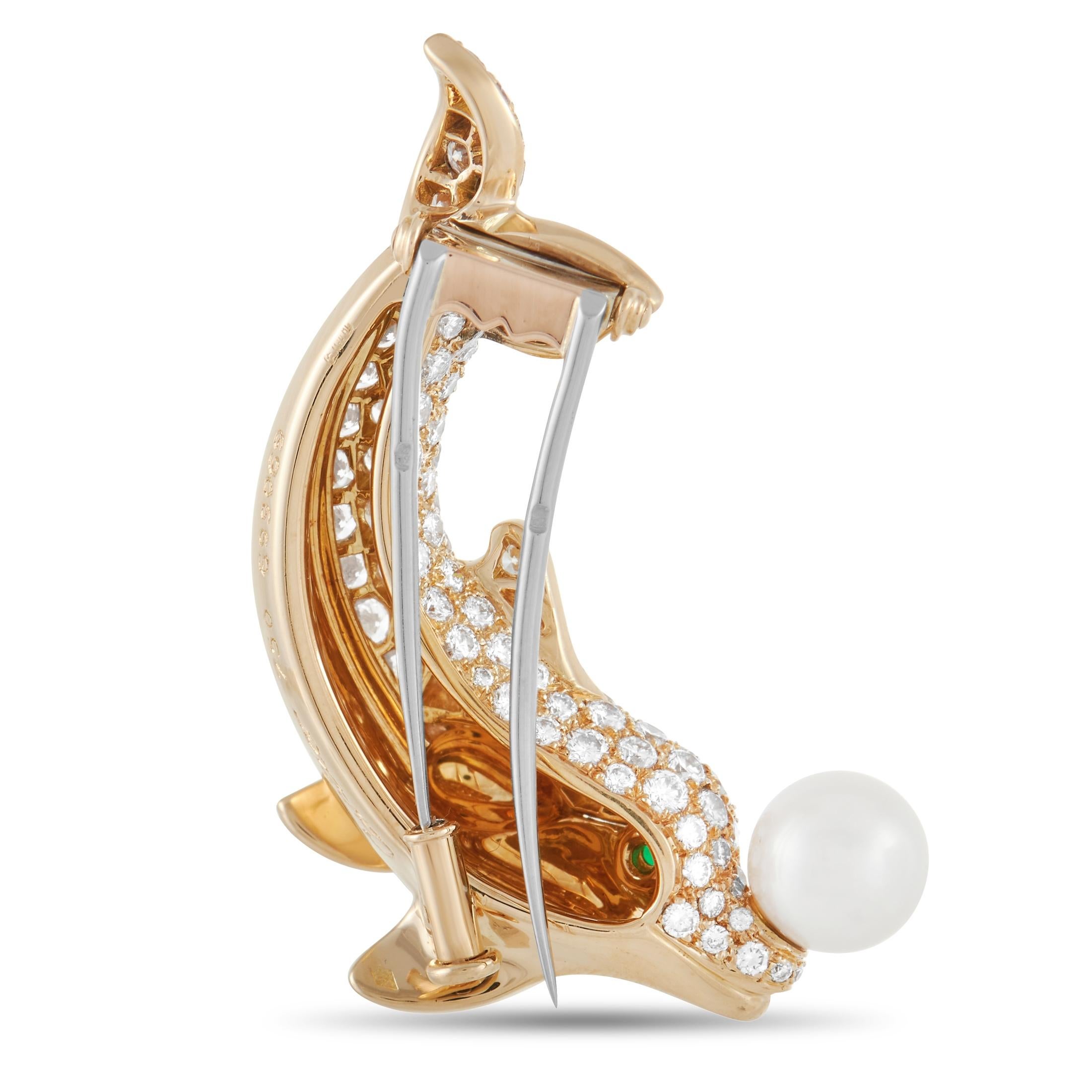 There’s something inherently whimsical about this charming Cartier brooch. The 18K yellow gold dolphin makes a statement thanks to inset diamond gemstones with a total weight of 2.10 carats. Emerald eyes and a pearl accent add a fabulous finishing