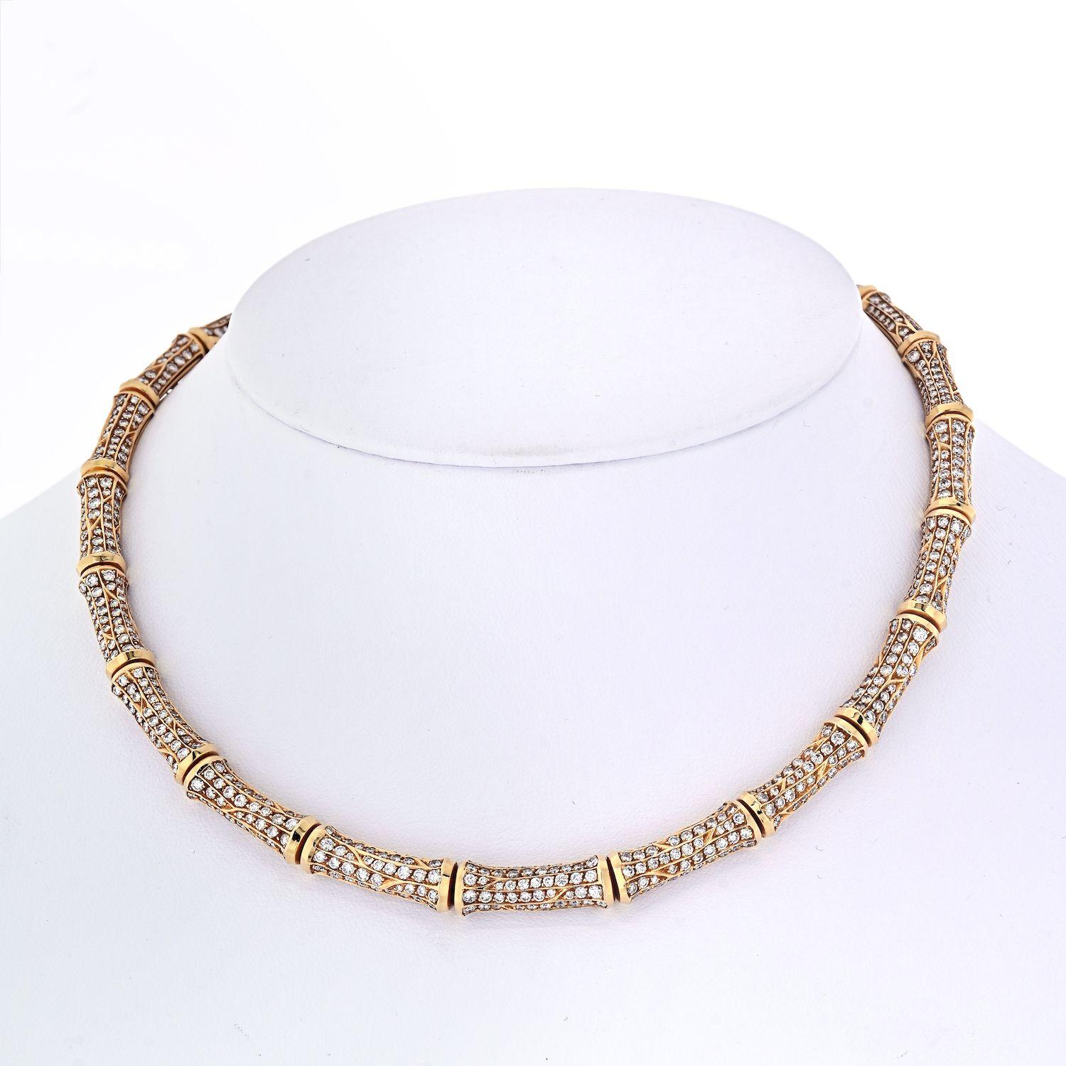 A notable necklace by Cartier, designed as a series of bamboo motif set with brilliant-cut diamonds weighing approximately 22.00 carats, mounted in 18k yellow gold. This necklace lays as a collar perfect to wear day to night. 
Circa 1980's. Made in