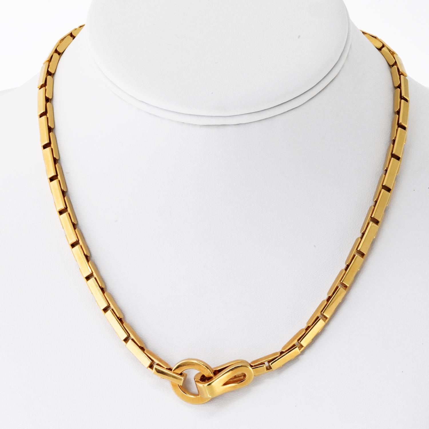 The Cartier Agrafe Necklace is a stunning example of Maison Cartier's unparalleled artistry and timeless design. Crafted in 18k yellow gold (750/000), this necklace embodies sophistication with its iconic 