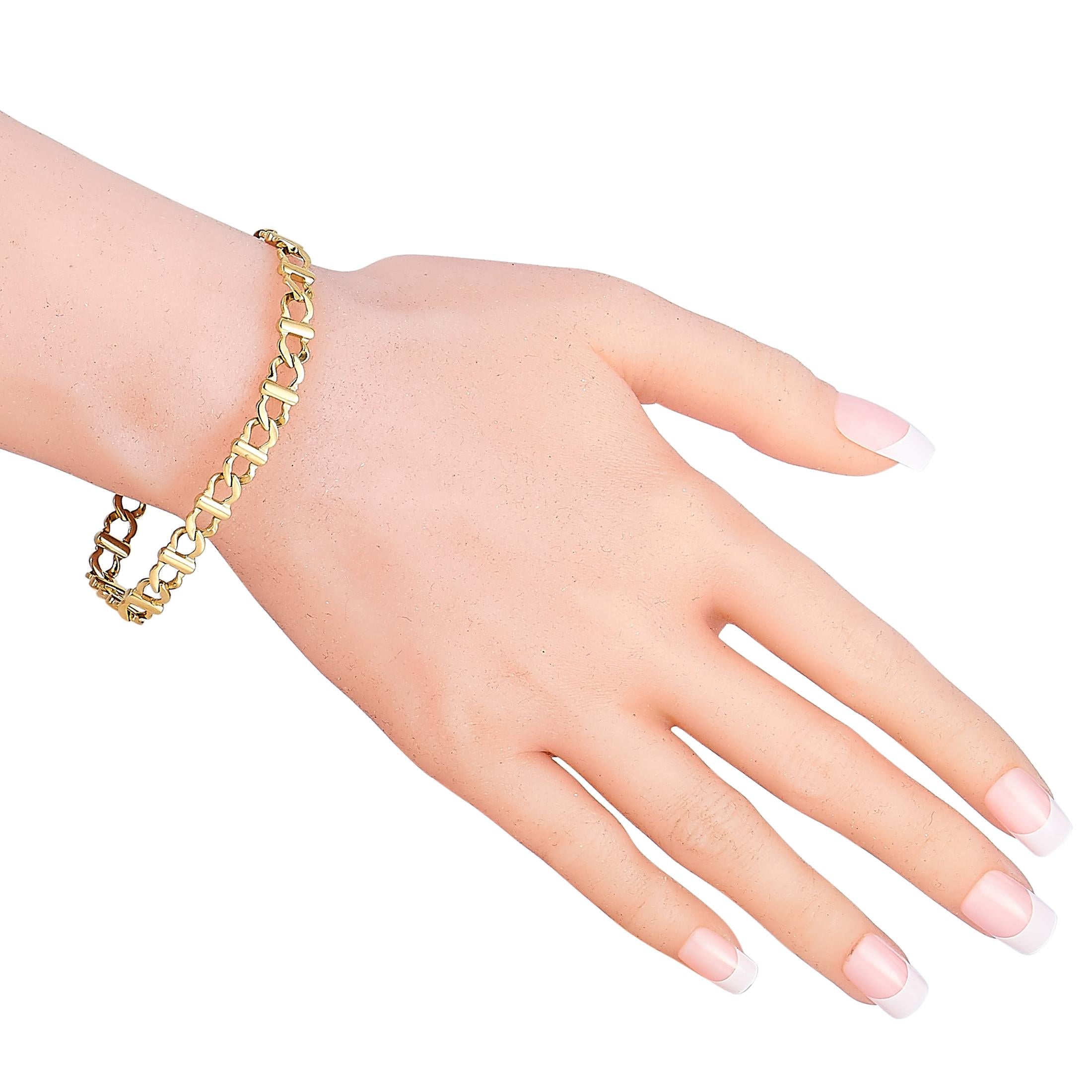 This Cartier bracelet is made of 18K yellow gold and weighs 18.8 grams, measuring 7” in length.

The bracelet is offered in estate condition and includes a gift pouch.