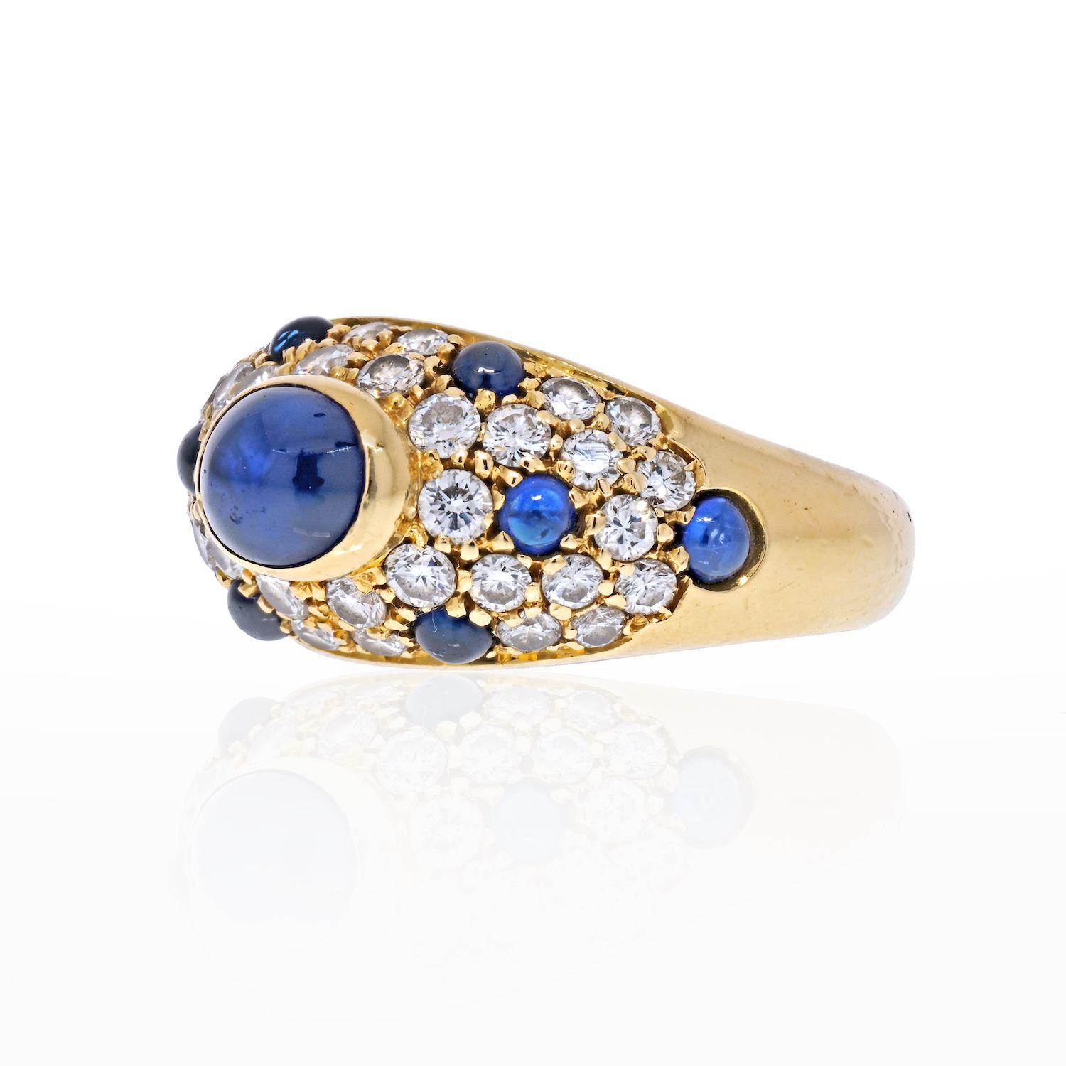 A beautiful vintage Cartier sapphire and diamond dome ring set in 18k yellow gold.
The ring is predominantly set with a large cabochon oval sapphire which is rub over set to centre. Surrounding this sapphire is a display of pave set diamonds and