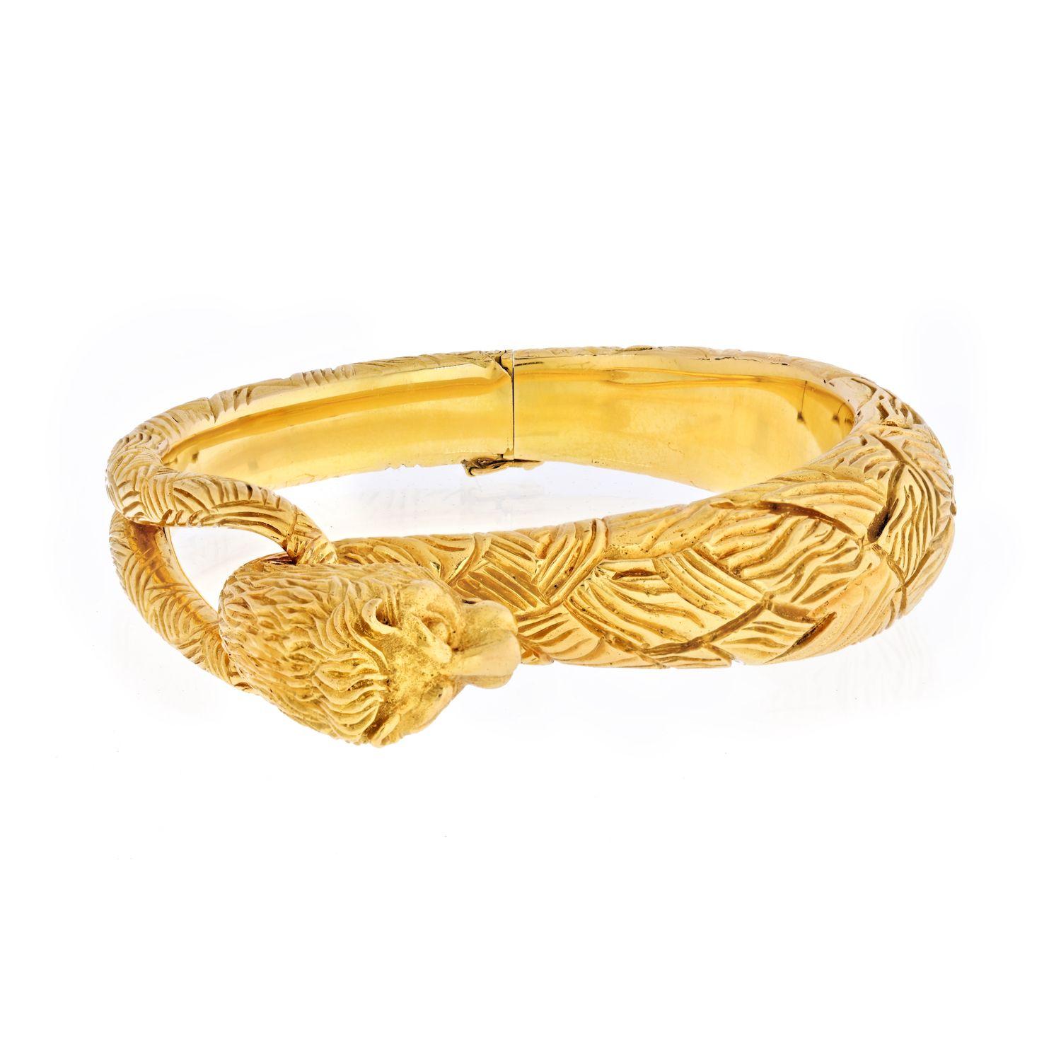Modern Cartier 18 Karat Yellow Gold Carved Lion Bangle Bracelet For Sale