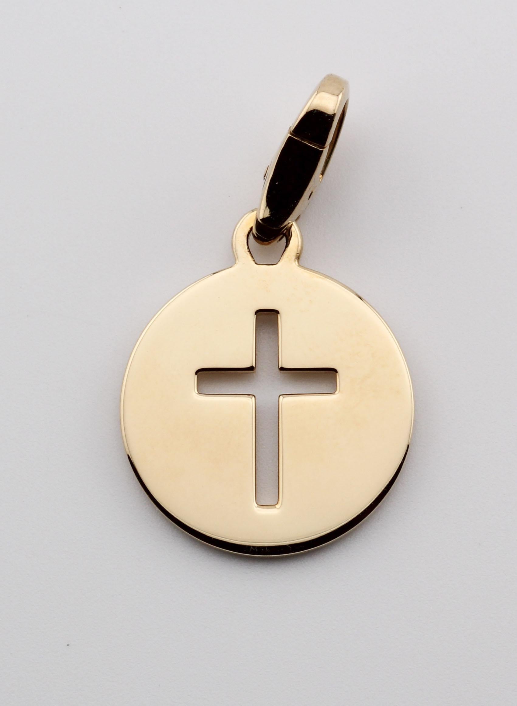 The Cartier 18K Yellow Gold Cross Charm Pendant is a sophisticated piece that exemplifies the brand's dedication to timeless elegance and refined craftsmanship. This charm pendant is crafted from luxurious 18k yellow gold, giving it a sleek,