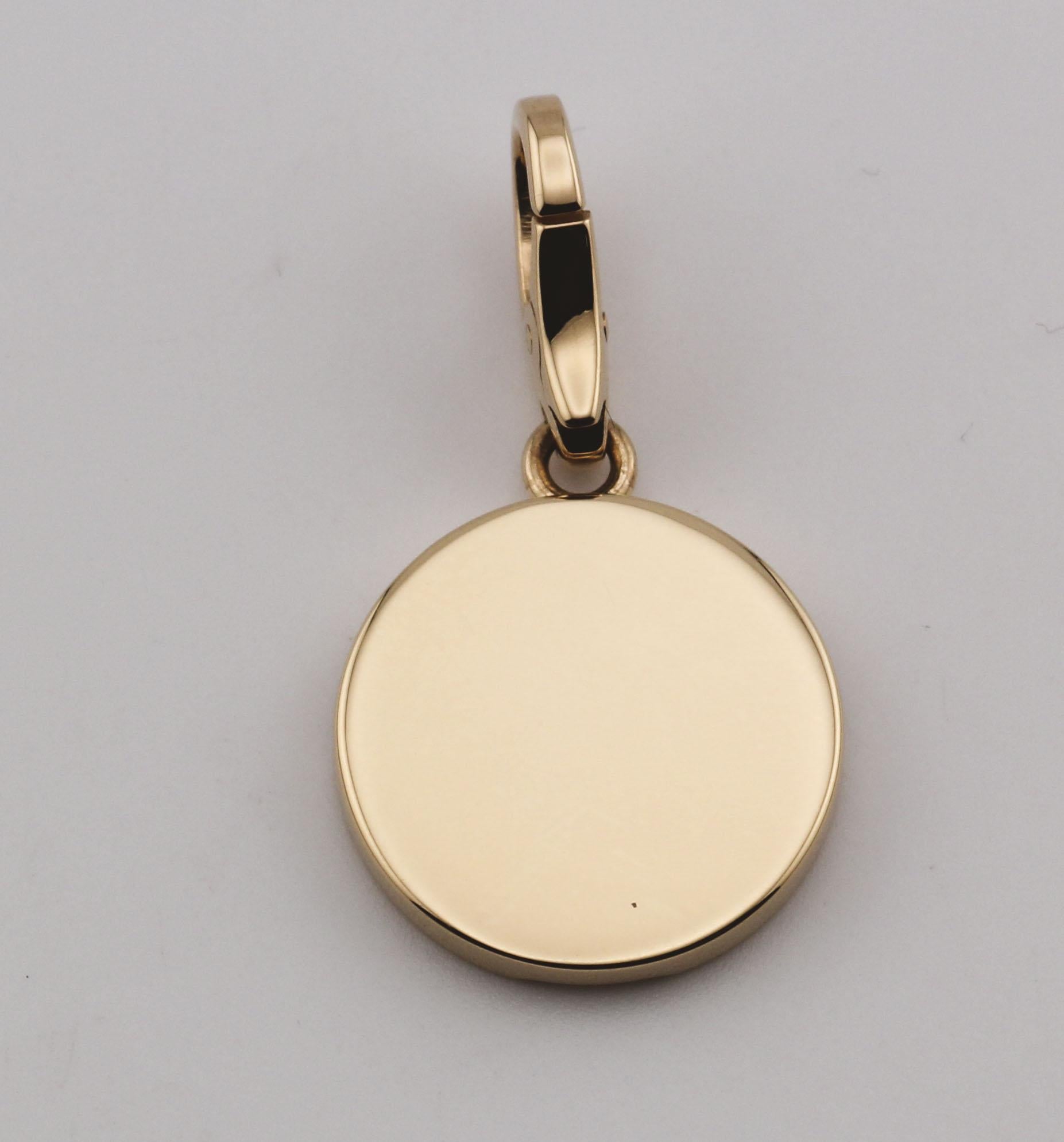 The Cartier 18K Yellow Gold Cross Charm Pendant is a sophisticated piece that exemplifies the brand's dedication to timeless elegance and refined craftsmanship. This charm pendant is crafted from luxurious 18k yellow gold, giving it a sleek,