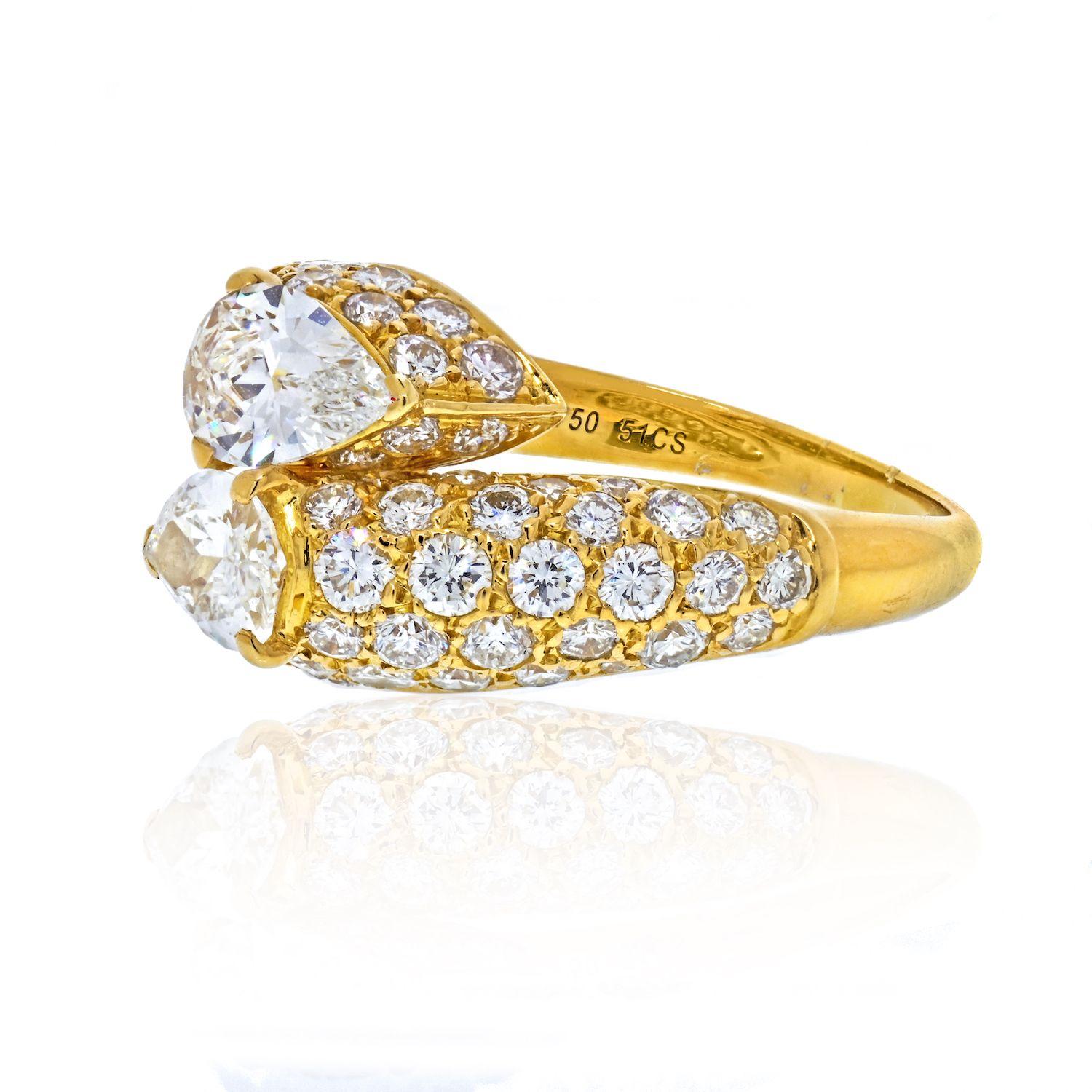 Rare Discontinued Cartier Deux Tetes Croisees Diamond Ring. 

Set with 2 pear shape brilliant cut diamonds and pave round brilliant cut diamonds. 

This design ring is also referred as a bypass or crossover. 

This ring dazzles with the slight of