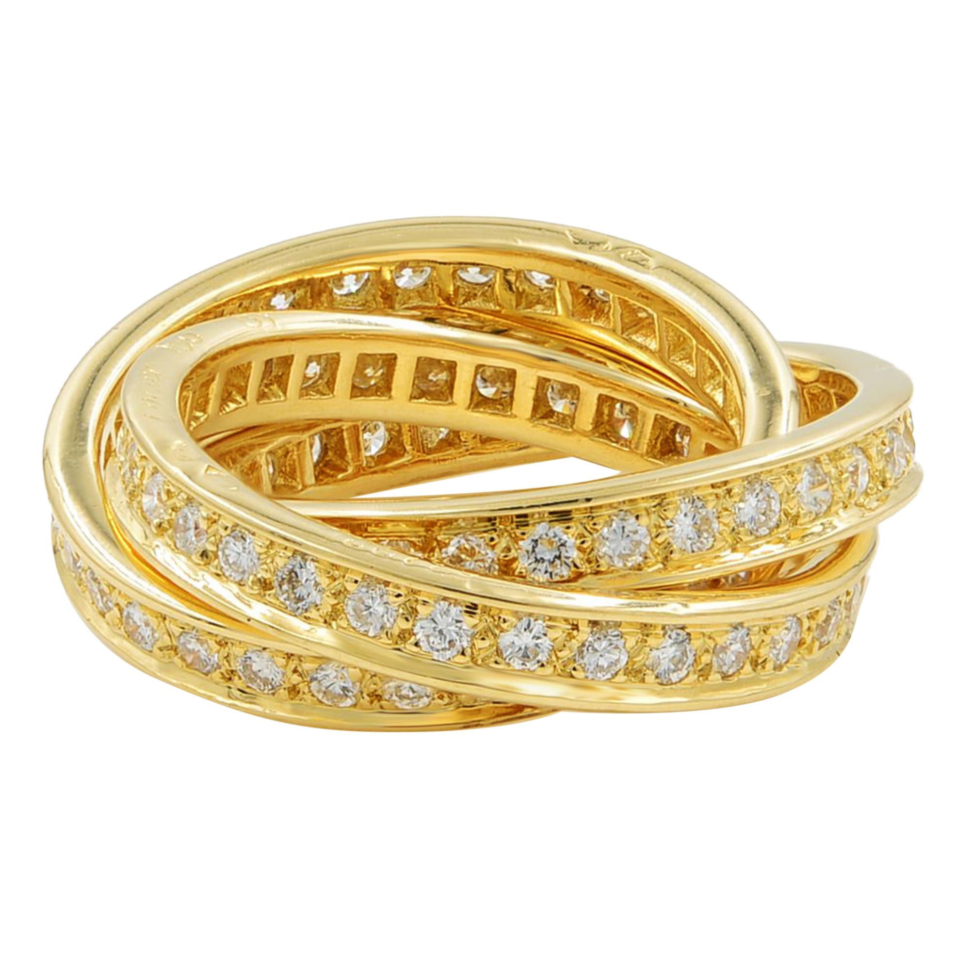 18k yellow gold diamond trinity band, by Cartier, France. This diamond-set Cartier's iconic Trinity rolling ring is impeccably chic. Set with 1.55 carats of superb diamonds. It is meticulously fabricated and comes with its original box and