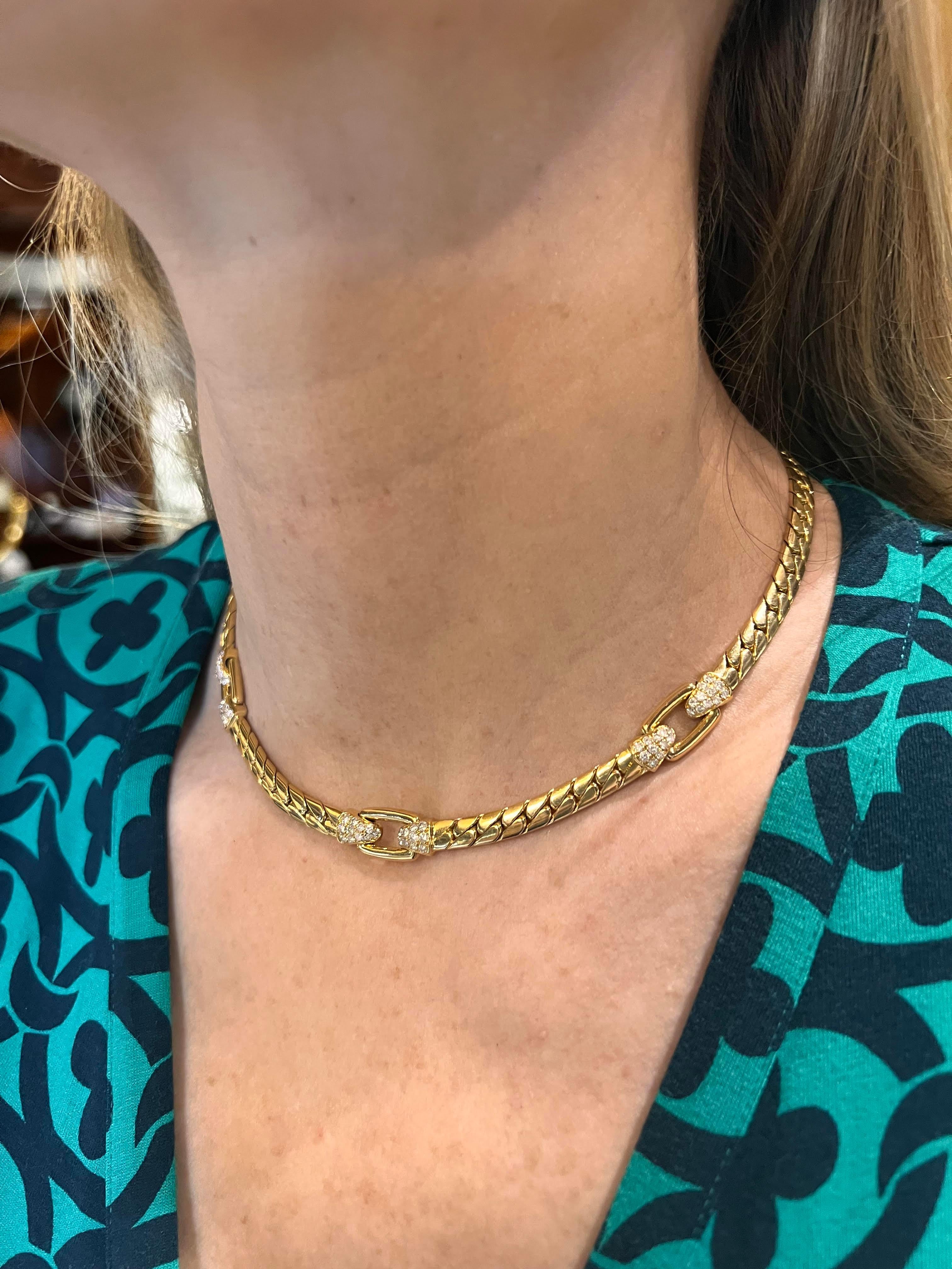 Curb-link collar necklace in polished 18k yellow gold, featuring three open oval-shaped links each flanked by triangular sections pave-set with round diamonds.  Sixty-six round full-cut diamonds weighing approximately 2.00 total carats.  Hidden
