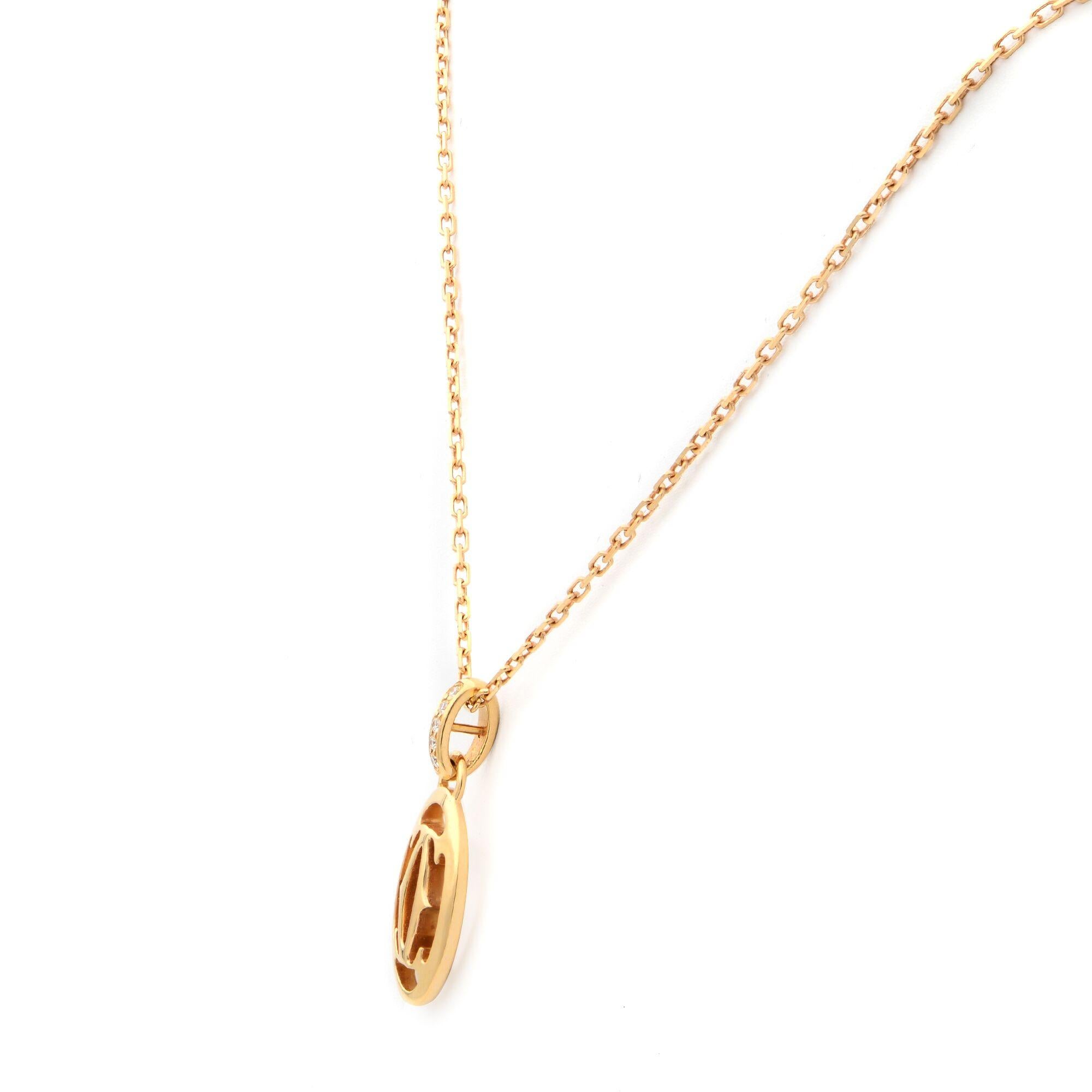 This stunning necklace from Cartier features a 18K rose gold chain with an oval pendant bordered with diamonds and a double C in the center. This elegant piece defines the timeless appeal of Cartier. Total carat weight: 0.02cts. Chain length: 16
