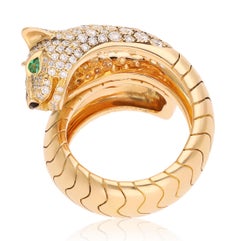Bague « Panther Wrap » CARTIER en or jaune 18 carats, sertie de diamants, d'émeraudes et d'onyx