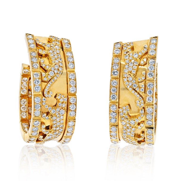 Cartier Vintage “Panthère de Cartier” walking panther diamond hoop earrings.
Made in 18K Yellow Gold encrusted with approx. 7.50cts of diamonds.

Circa 1980's 
French hallmarks.  

A true collector’s piece, each of these earrings is designed as a