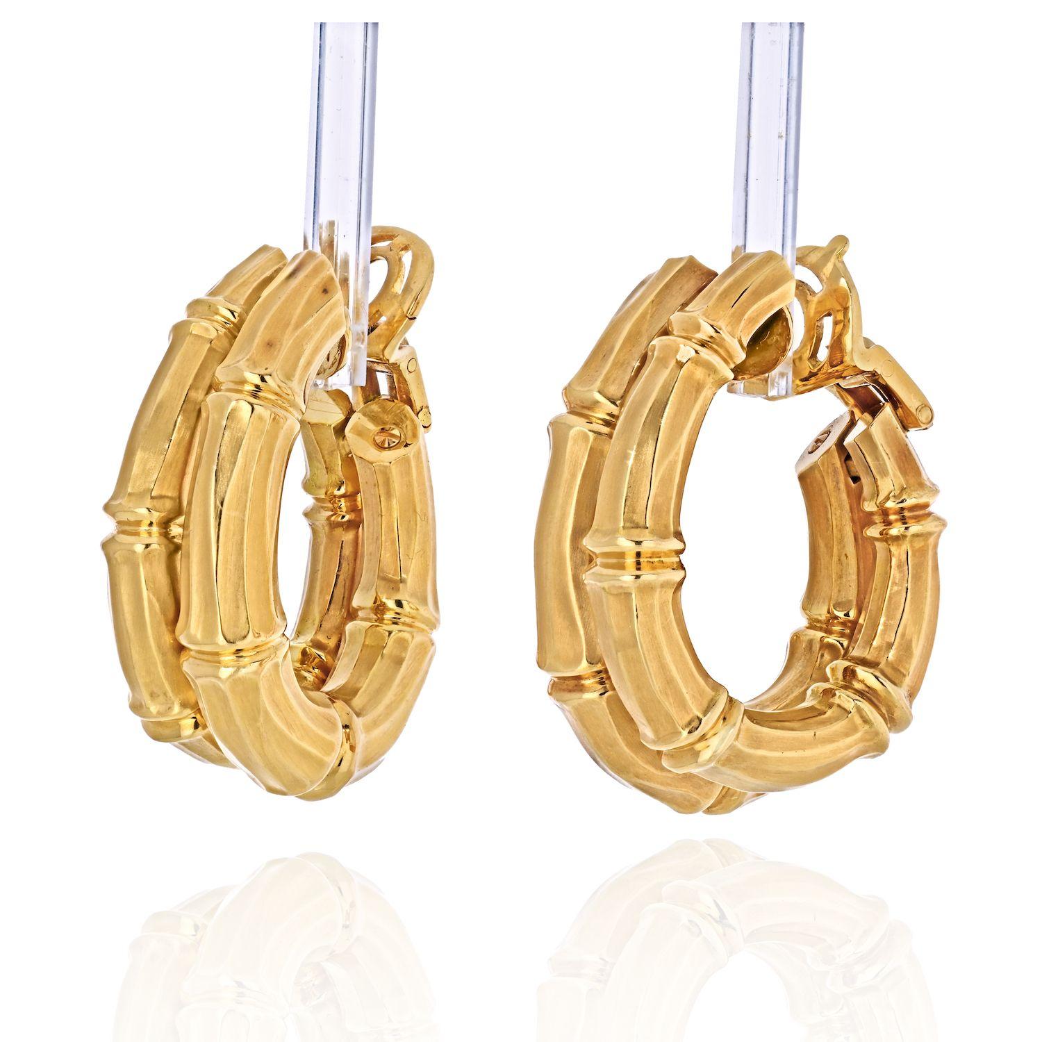 Cartier 18K Yellow Gold Double Bamboo Earrings. 
A beautiful pair of Cartier Gold Bamboo Earrings. Each earring depicts a double row of bamboo unaligned. These Cartier gold bamboo earrings are clip-on hoop earrings, circa 1990, stamped and